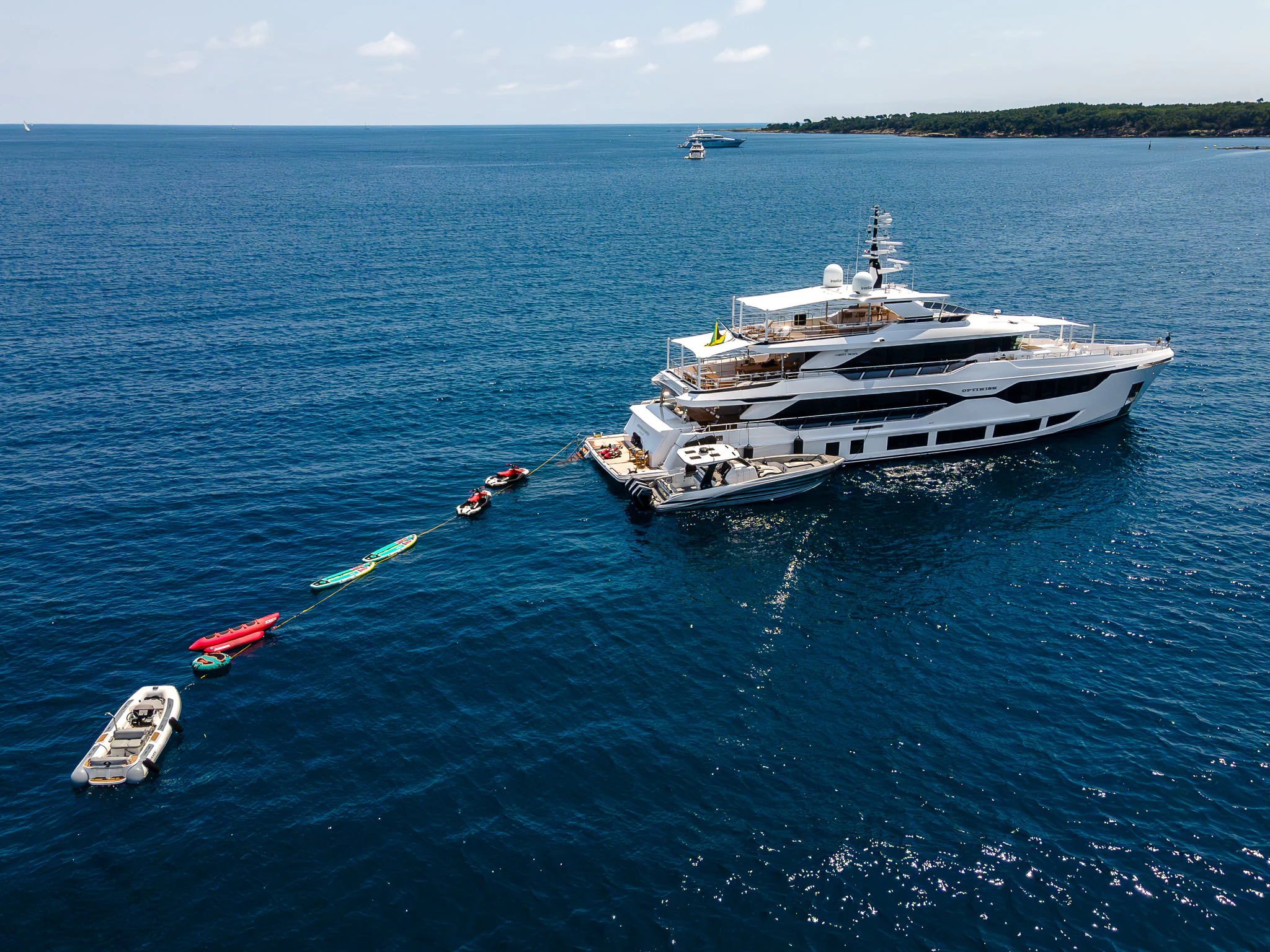 a group of boats in the water aboard OPTIMISM Yacht for Sale