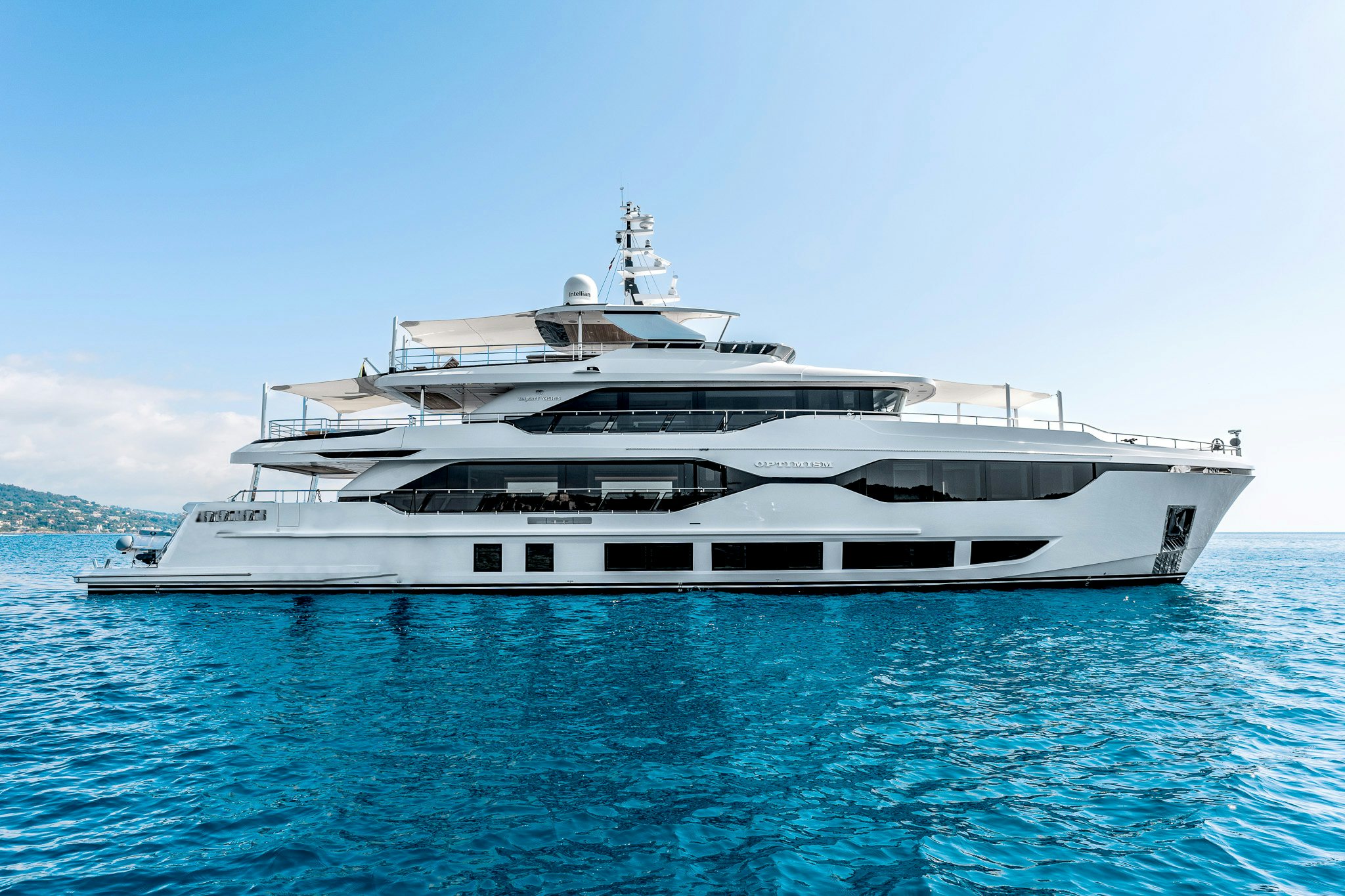 a large white yacht aboard OPTIMISM Yacht for Charter