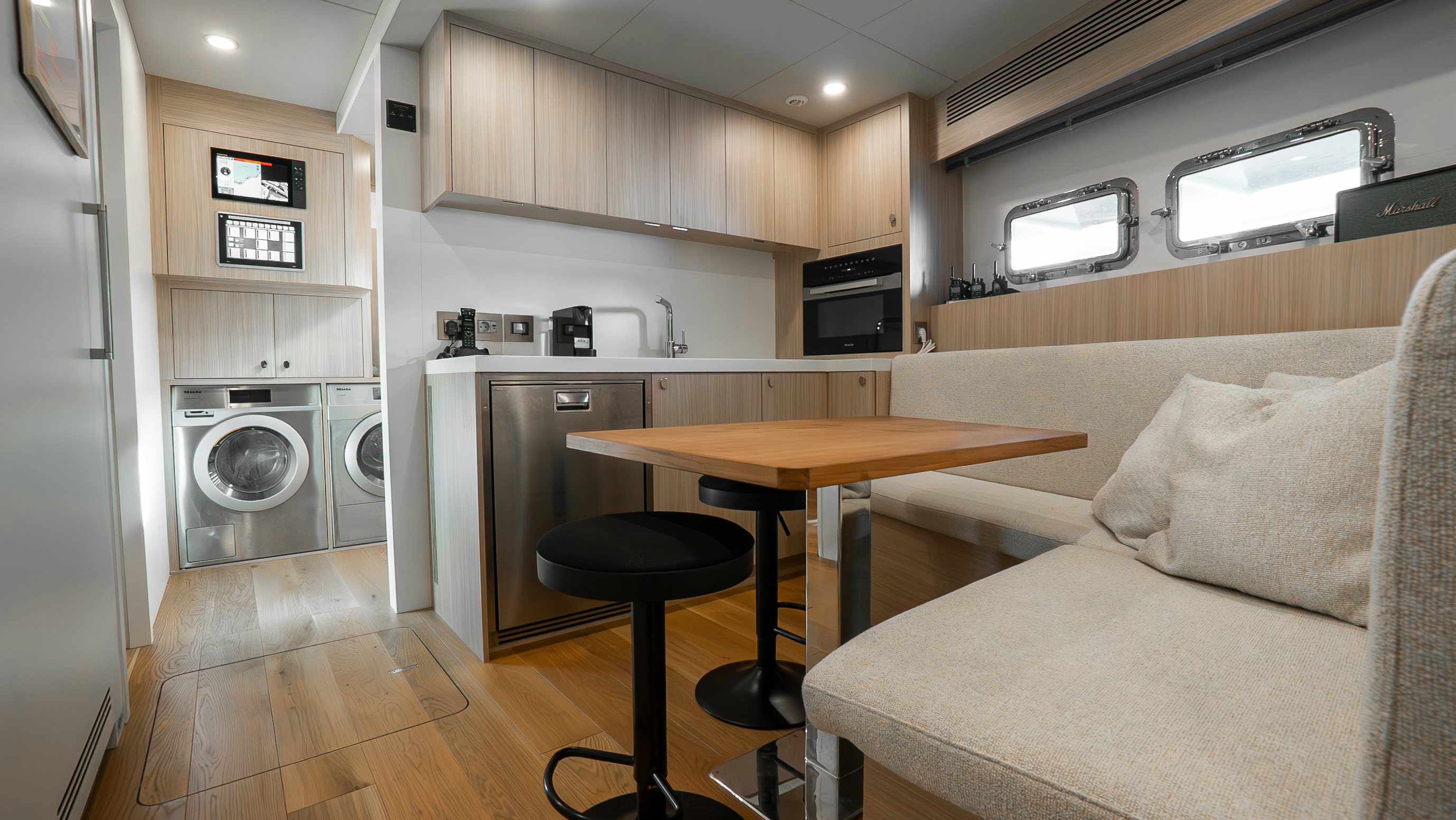 a living room with a couch and a table aboard RAY Yacht for Sale