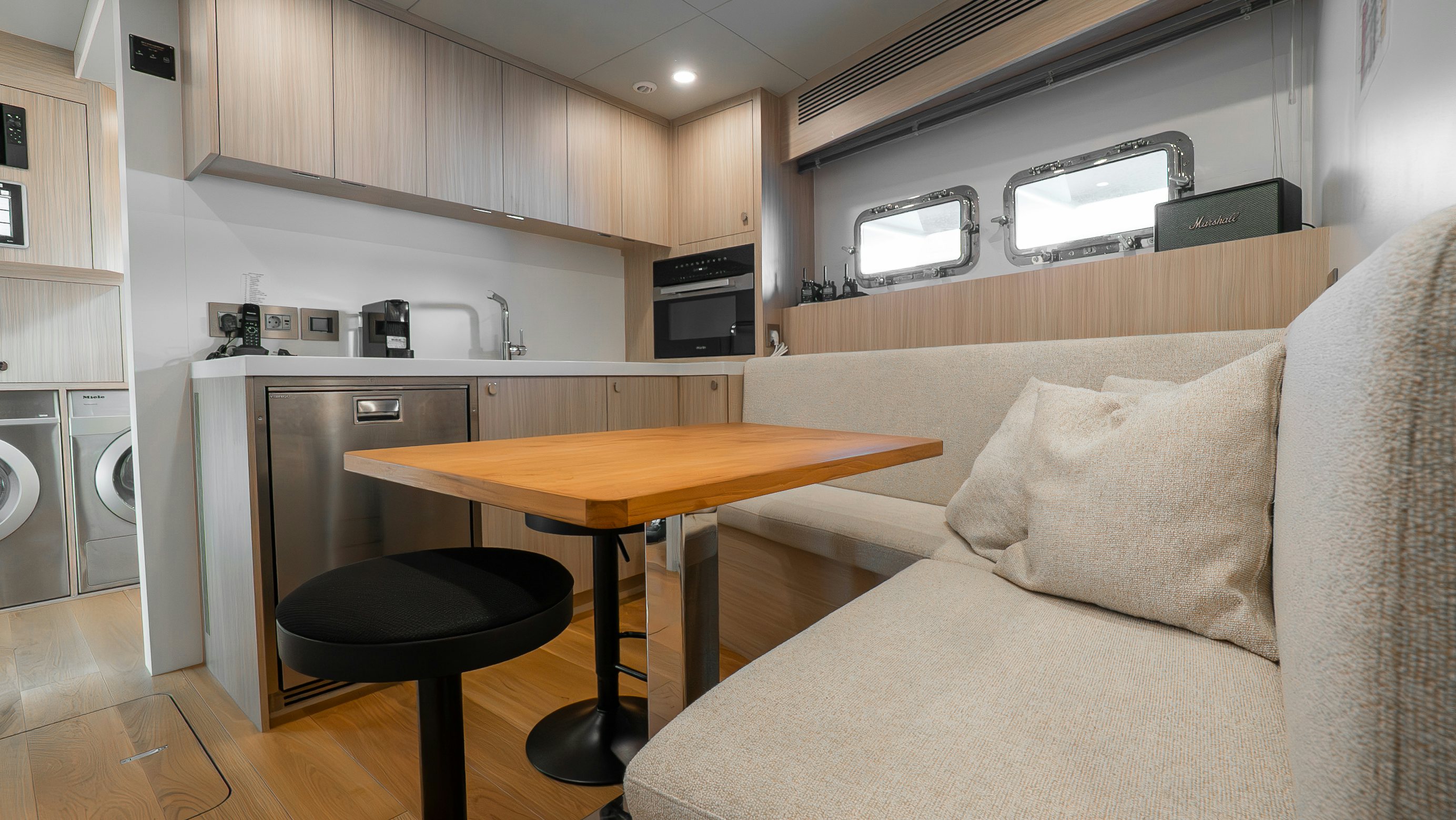 a living room with a couch and a table aboard RAY Yacht for Sale