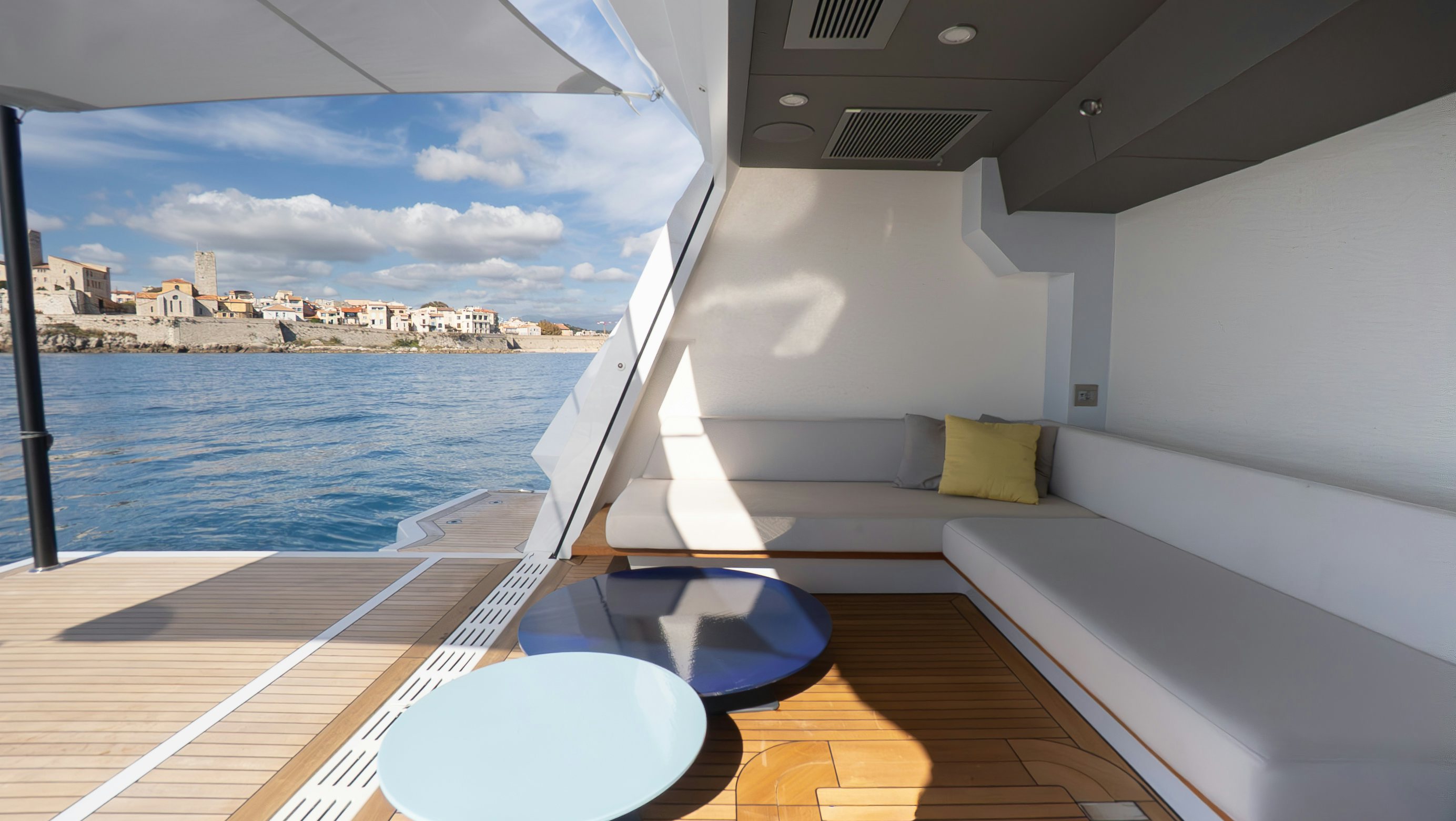 a room with a table and chairs aboard RAY Yacht for Sale