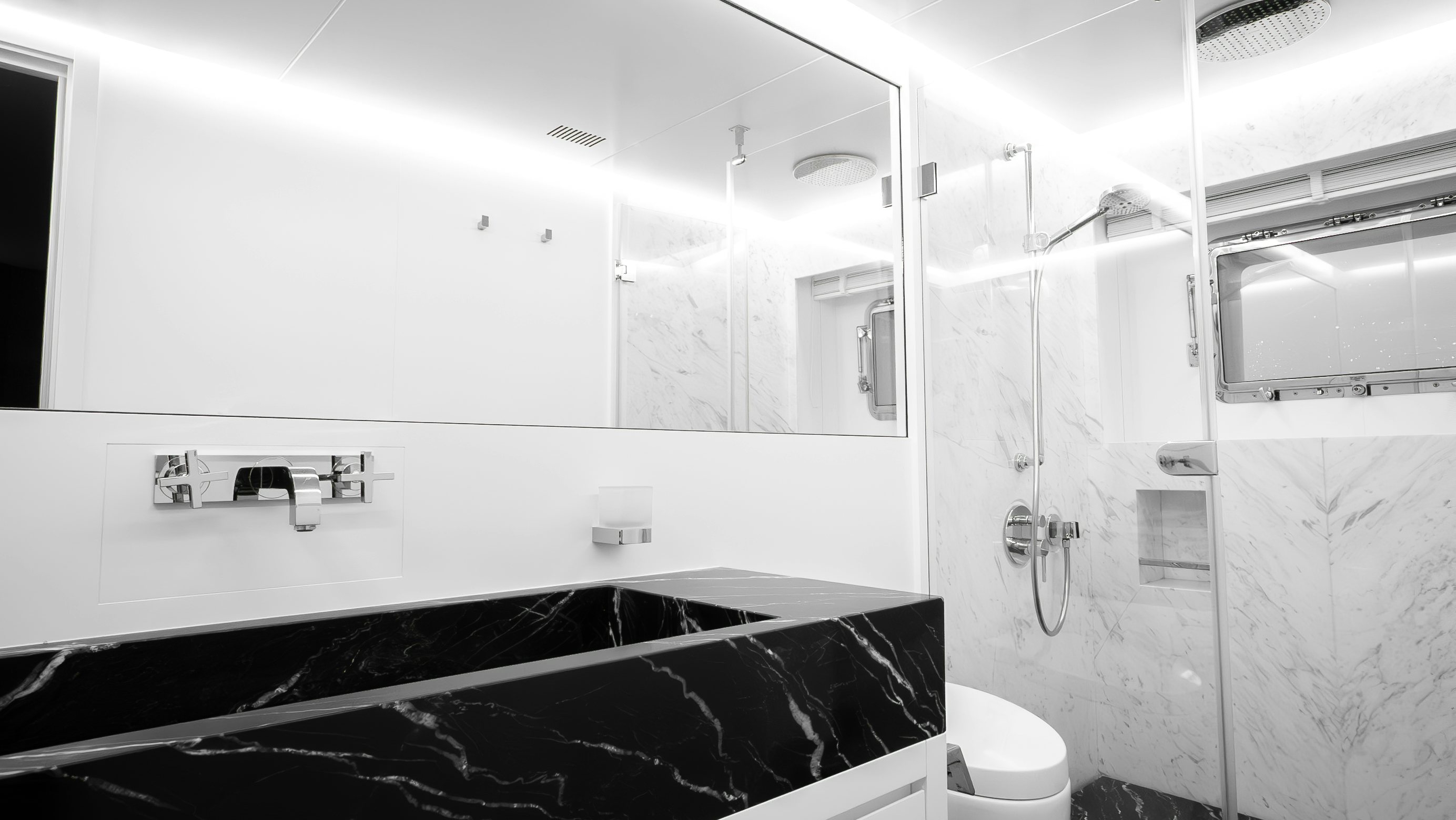 a bathroom with a tub sink and toilet aboard RAY Yacht for Sale