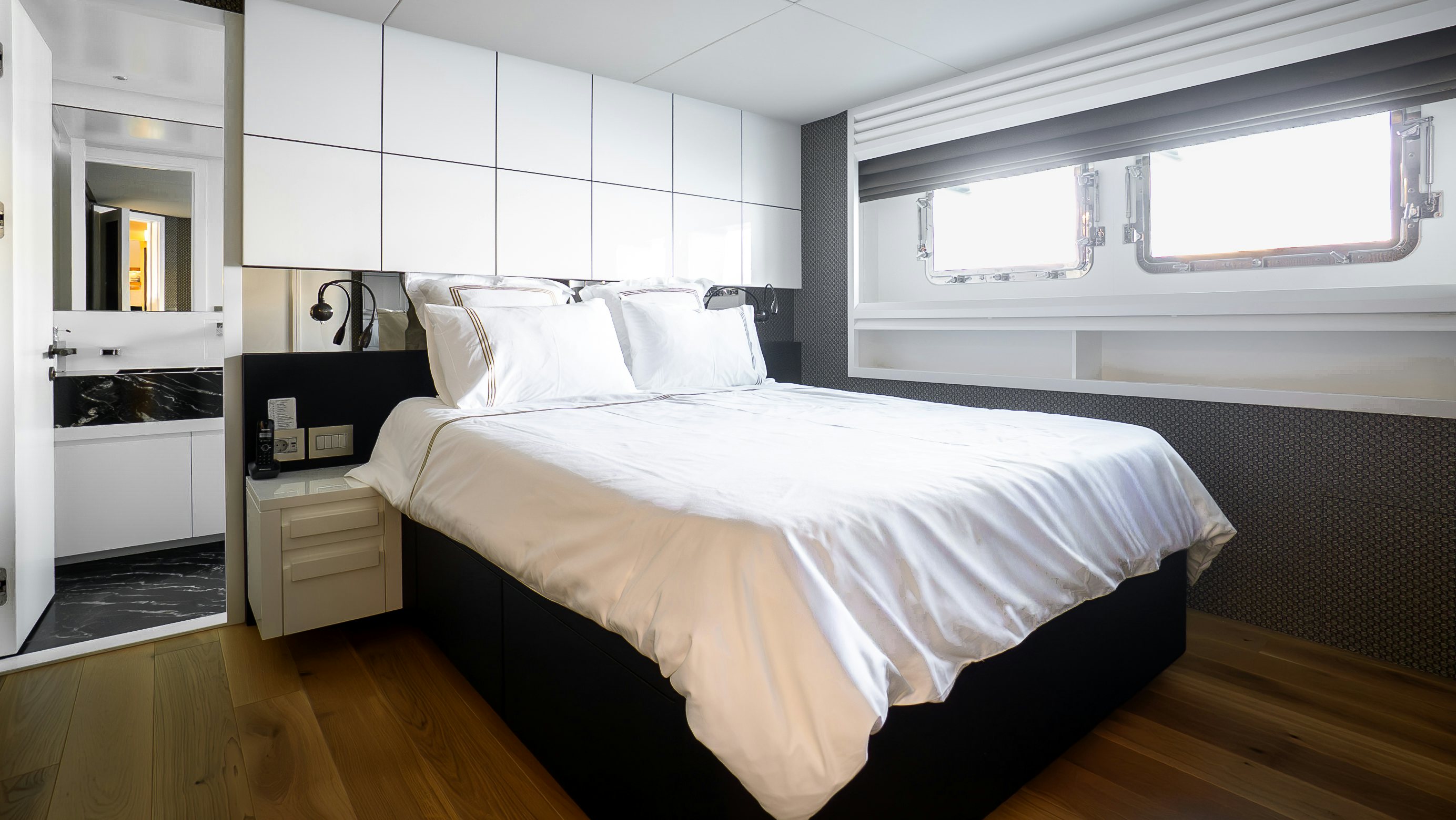a bed in a room aboard RAY Yacht for Sale
