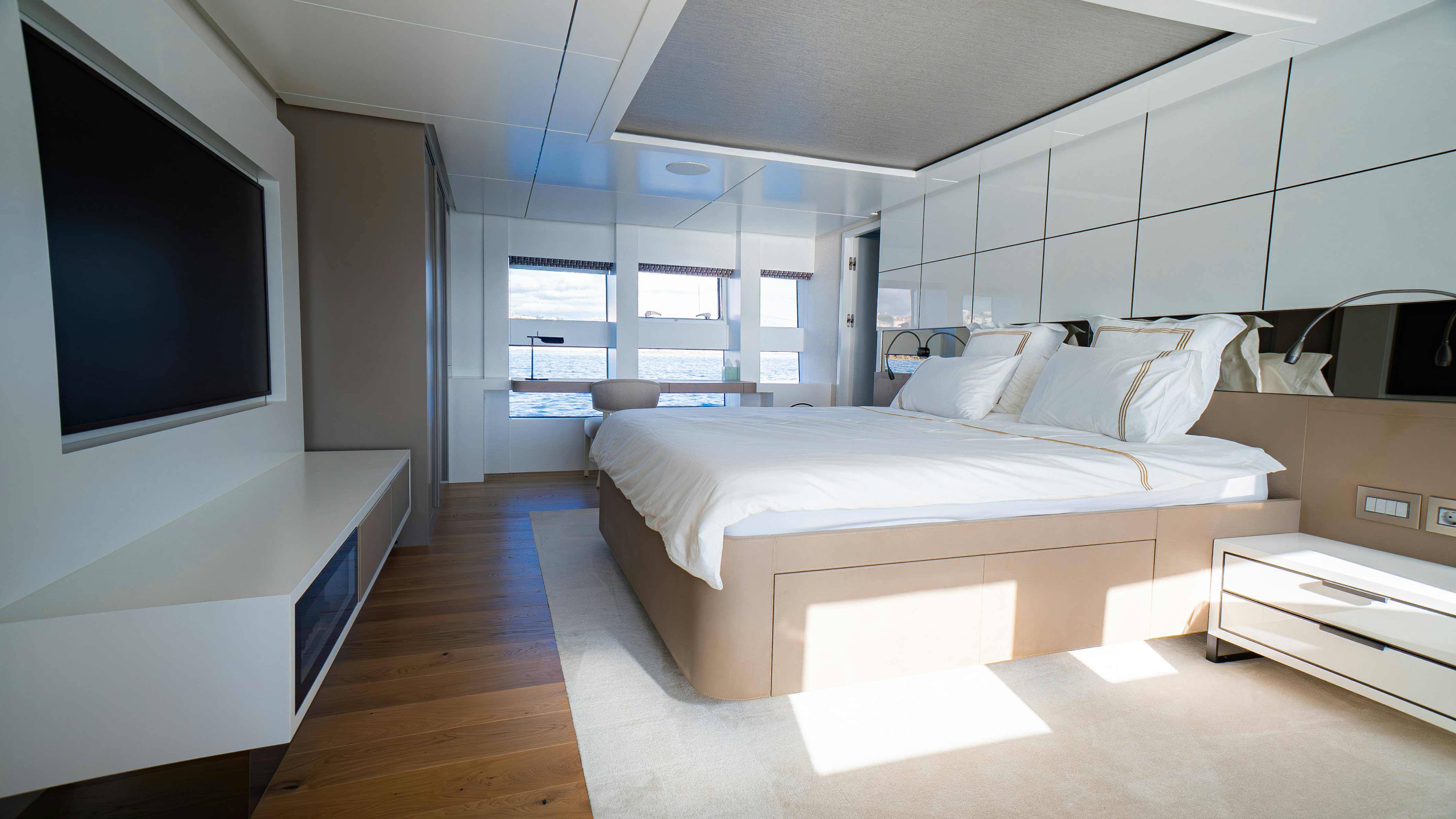 a room with a bed and a tv aboard RAY Yacht for Sale