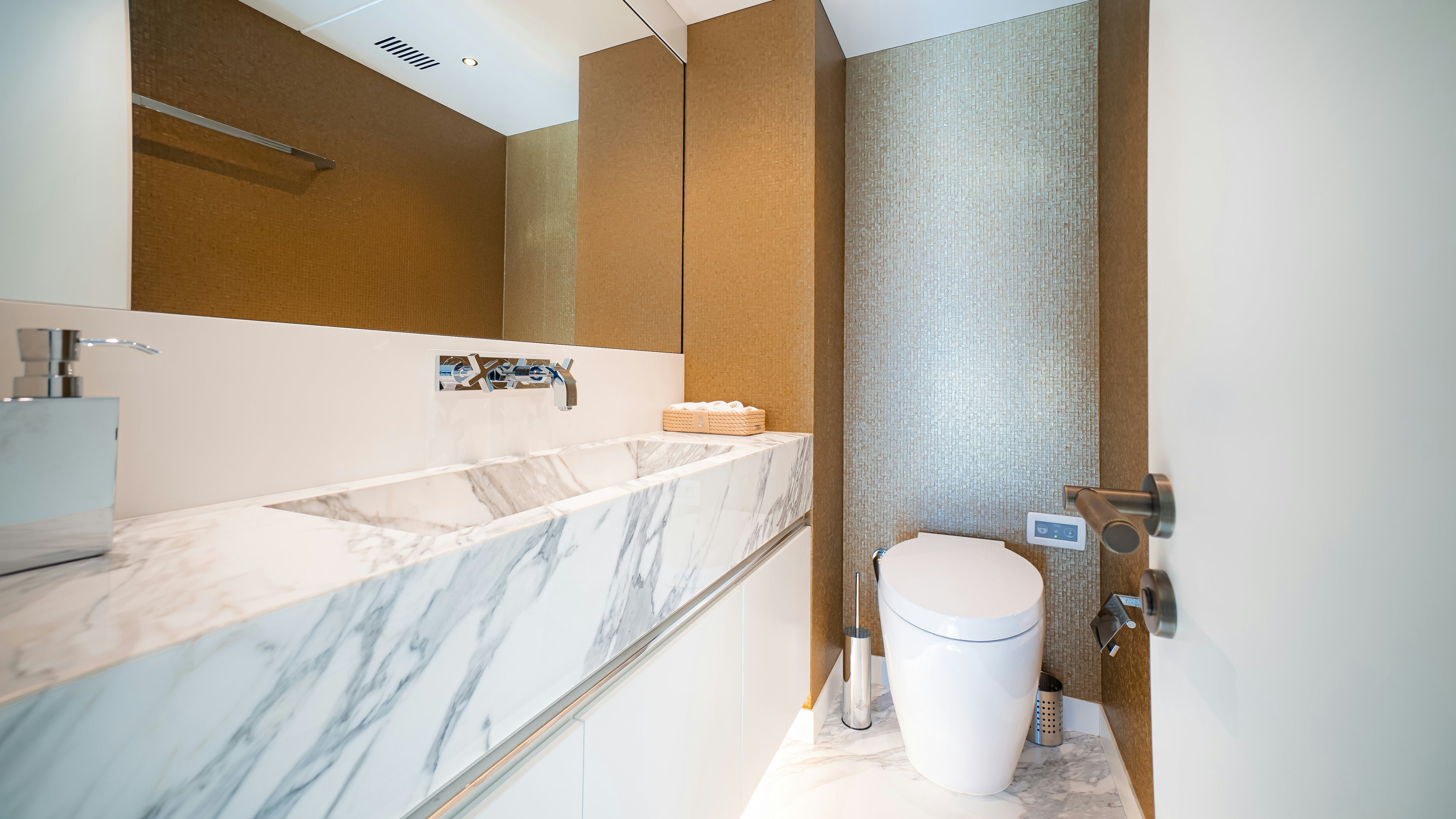 a bathroom with a tub sink and toilet aboard RAY Yacht for Sale