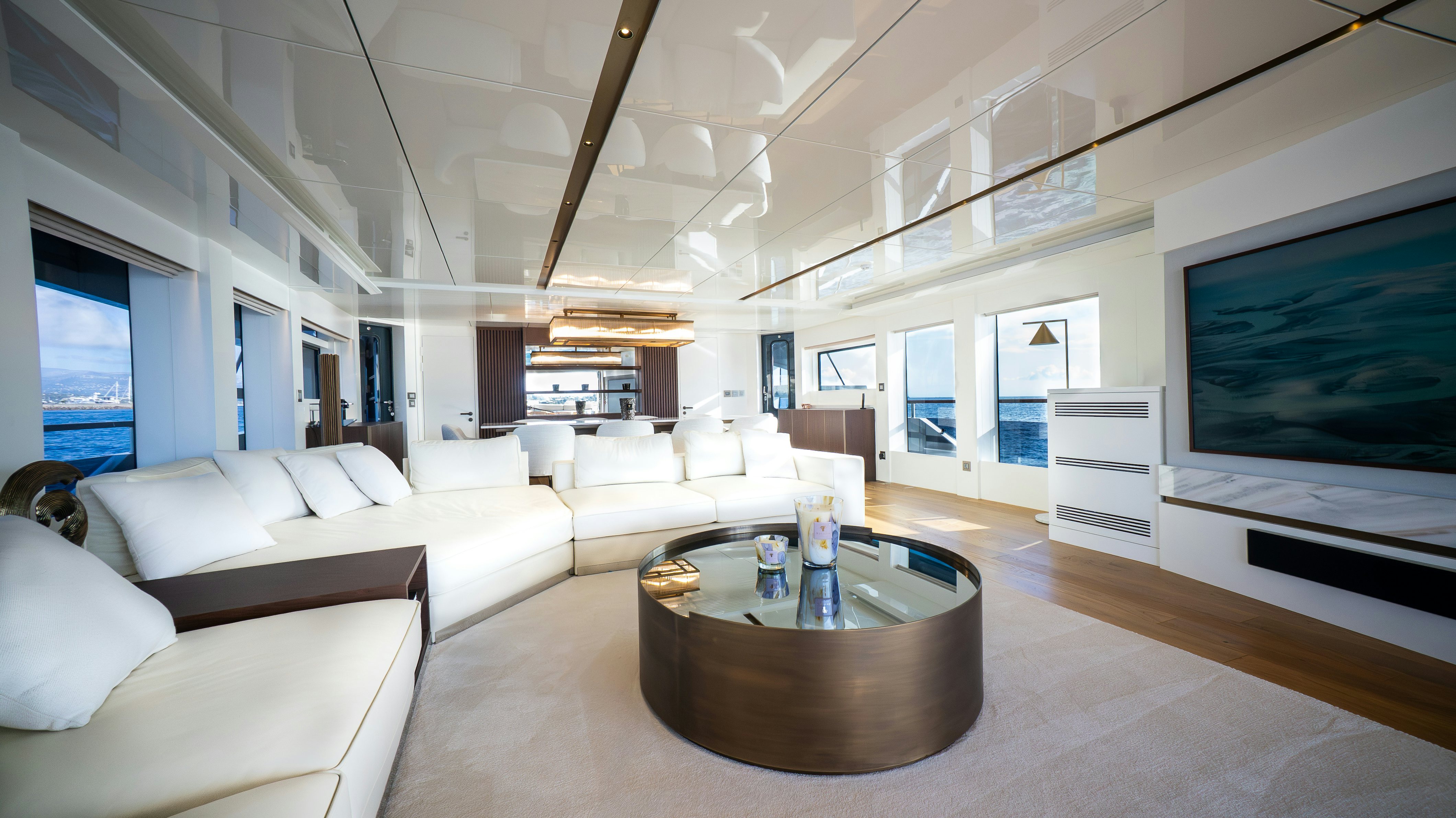 a living room with a large screen aboard RAY Yacht for Sale