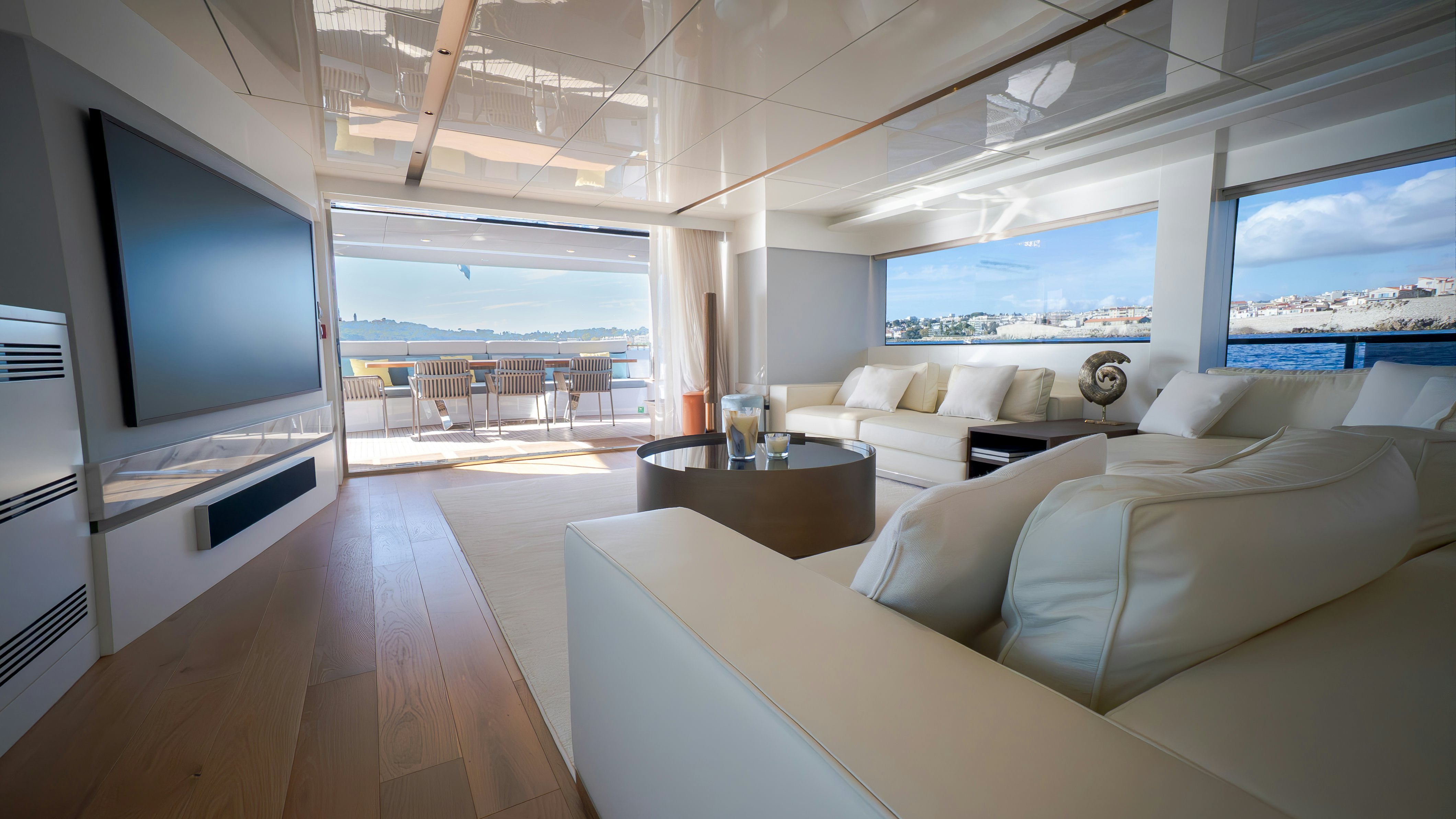 a living room with a large screen aboard RAY Yacht for Sale