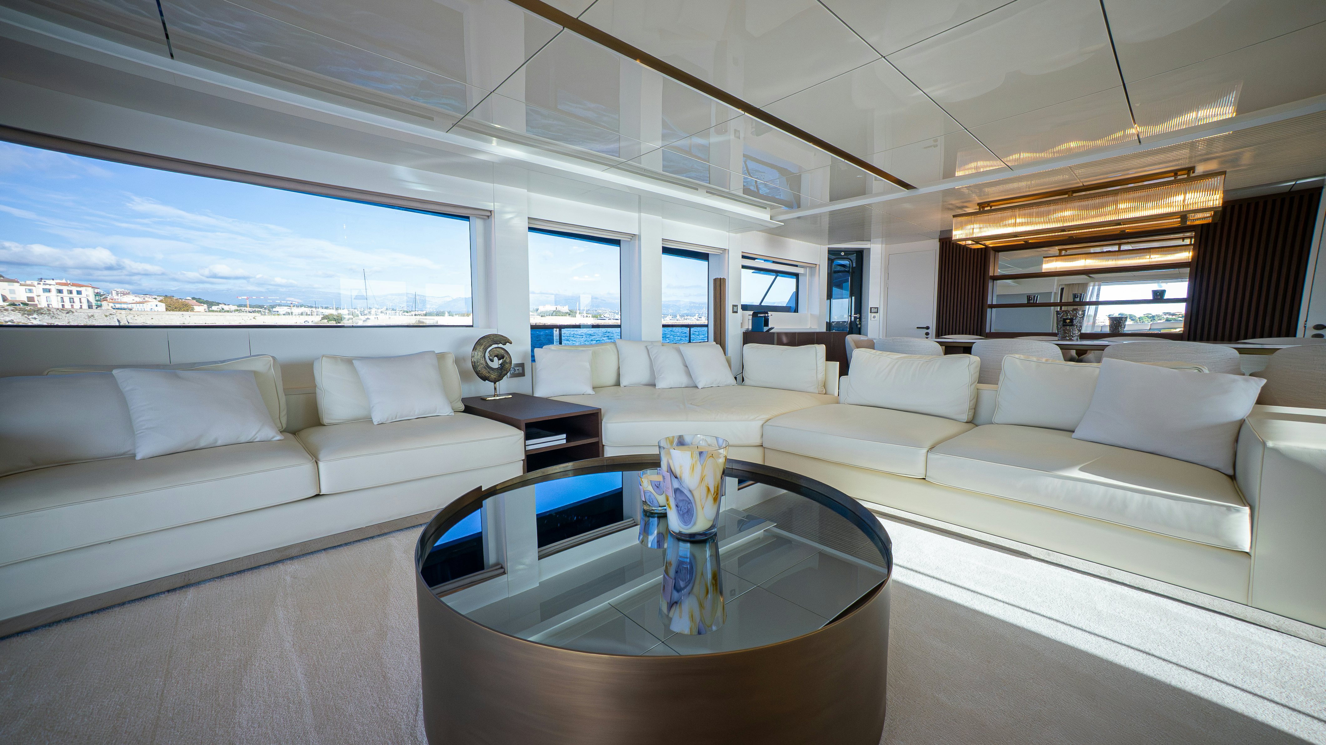 a living room with a couch and a coffee table aboard RAY Yacht for Sale