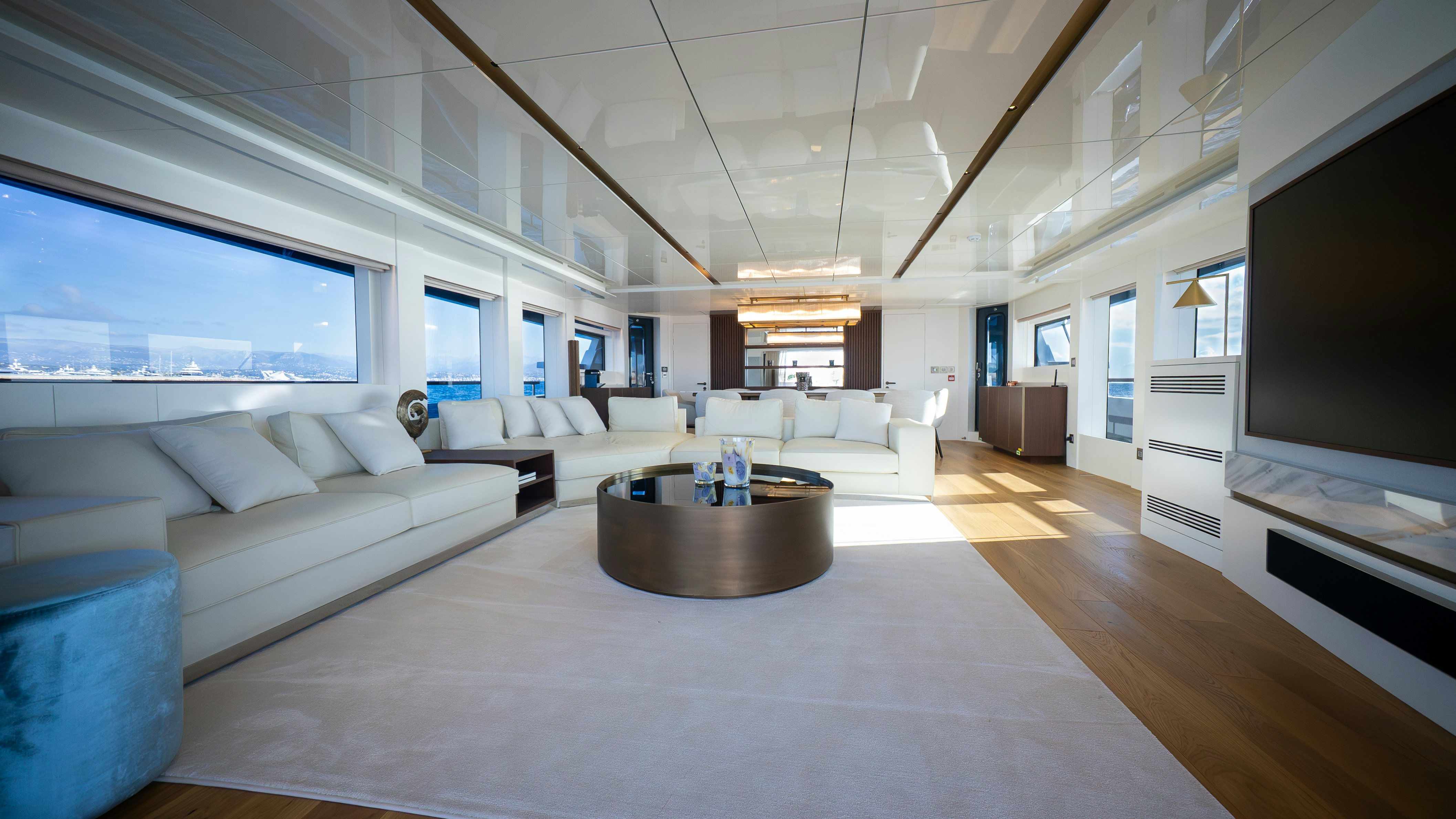 a living room with a large screen aboard RAY Yacht for Sale