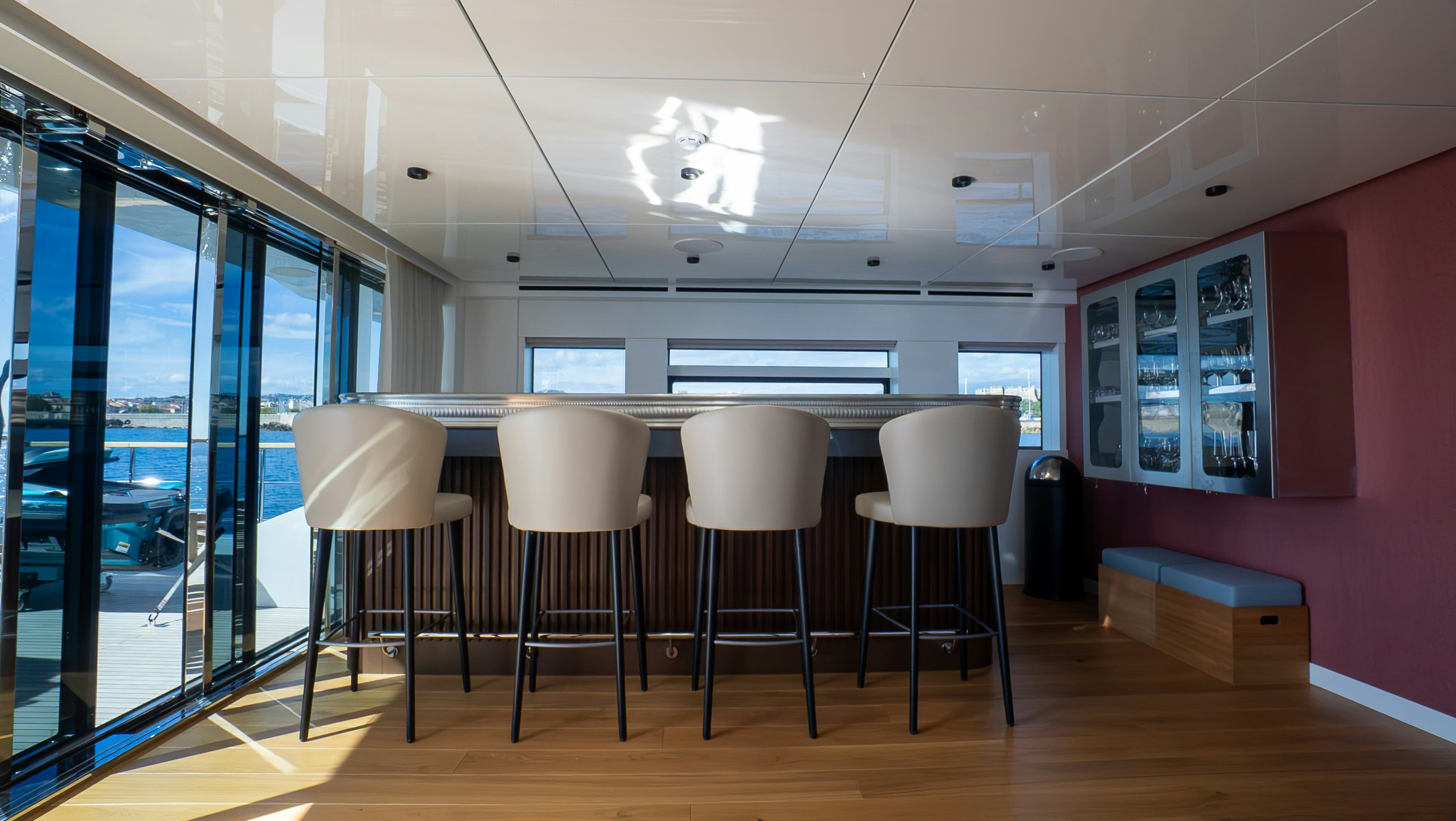 a room with a table chairs and a window aboard RAY Yacht for Sale