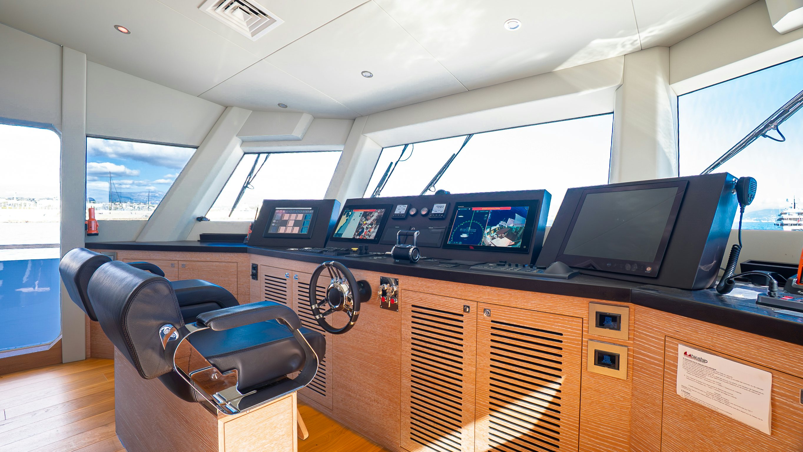 a room with a desk and computer aboard RAY Yacht for Sale