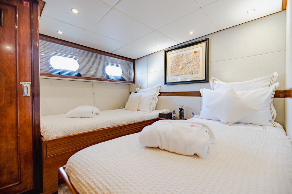a room with two beds aboard ALHAMBRA Yacht for Charter