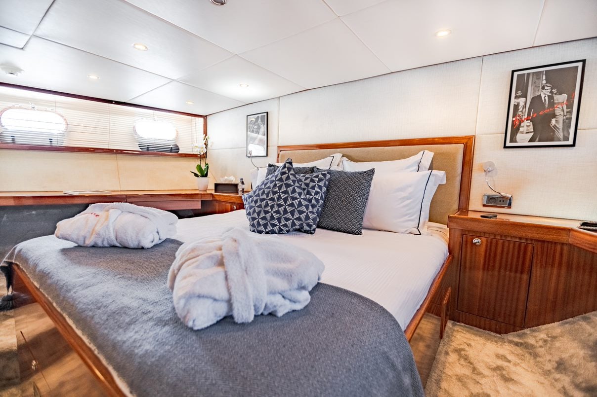 a bed with pillows on it aboard ALHAMBRA Yacht for Charter