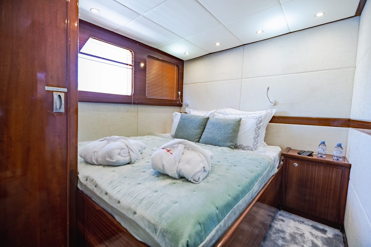 a bed in a room aboard ALHAMBRA Yacht for Charter
