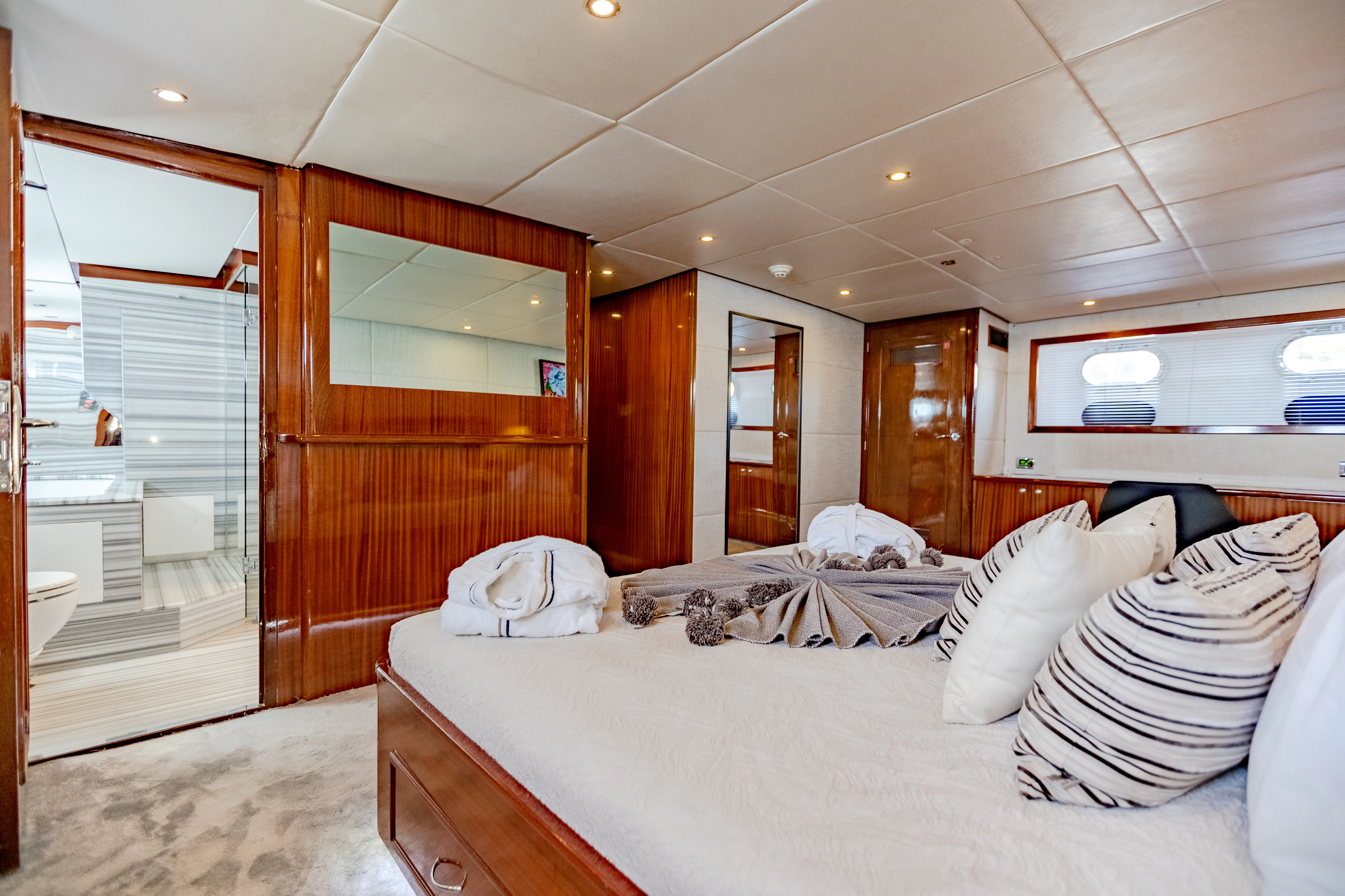 a room with a bed and a door aboard ALHAMBRA Yacht for Sale