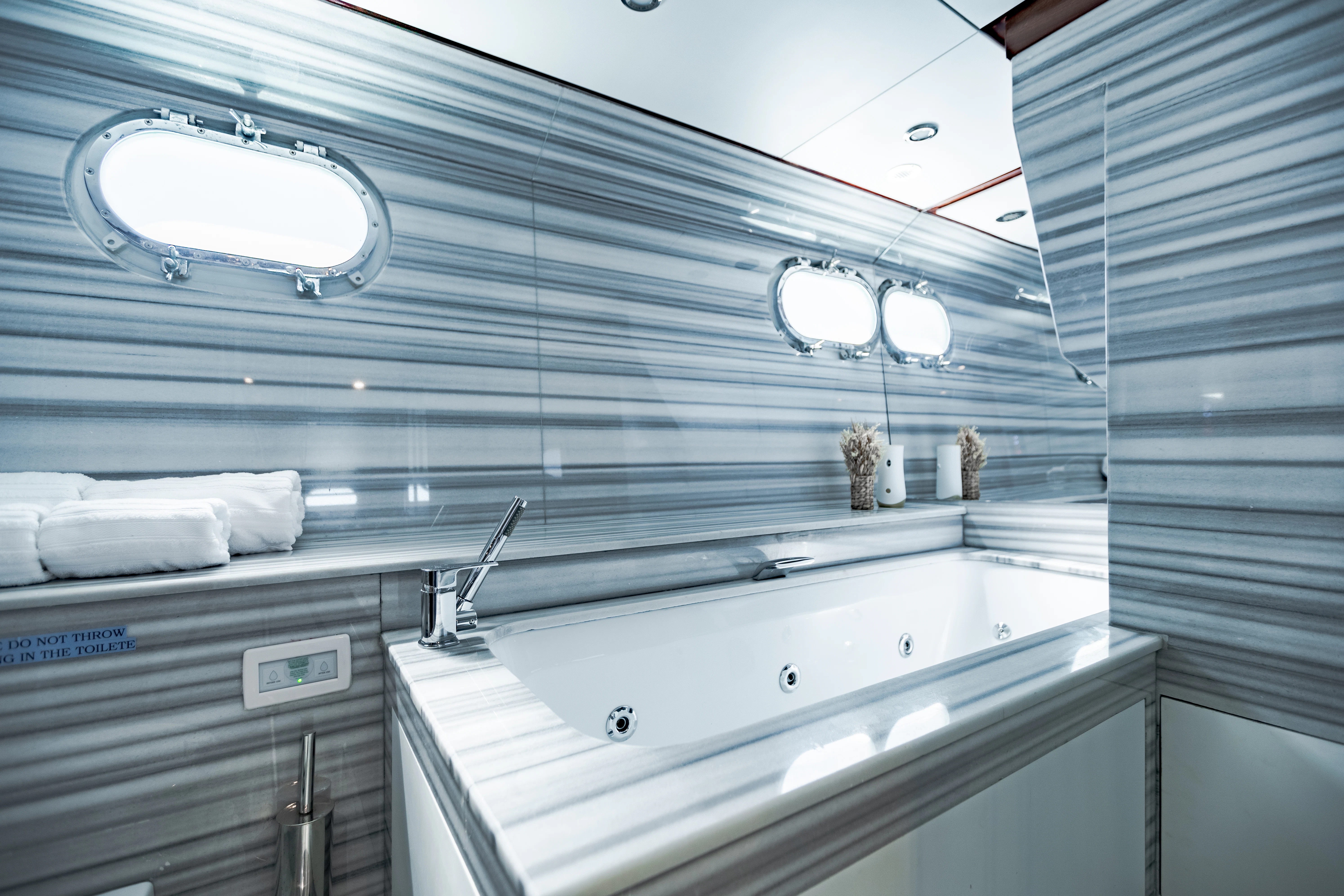 a bathroom with a large mirror aboard ALHAMBRA Yacht for Sale