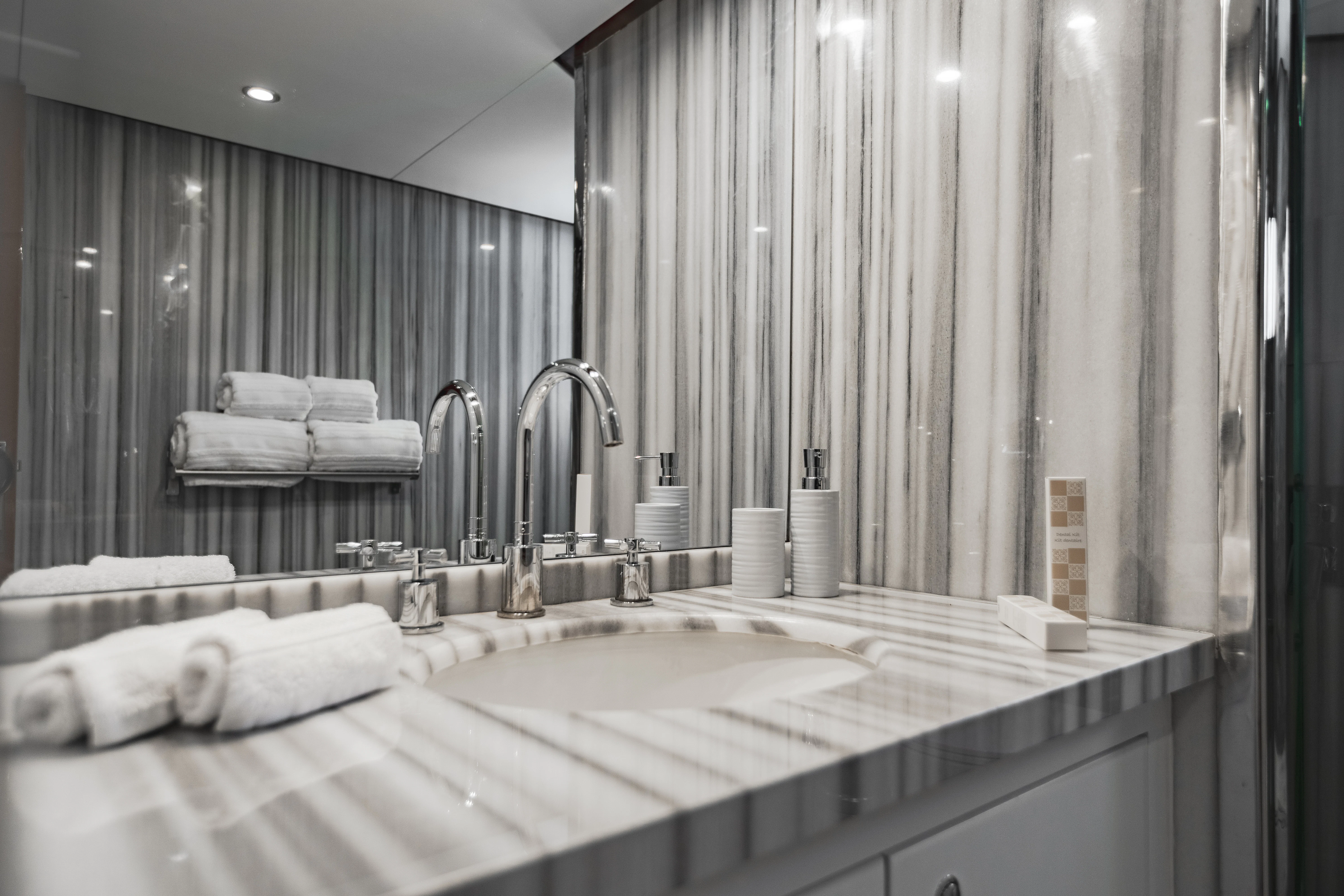 a bathroom with a large mirror aboard ALHAMBRA Yacht for Sale
