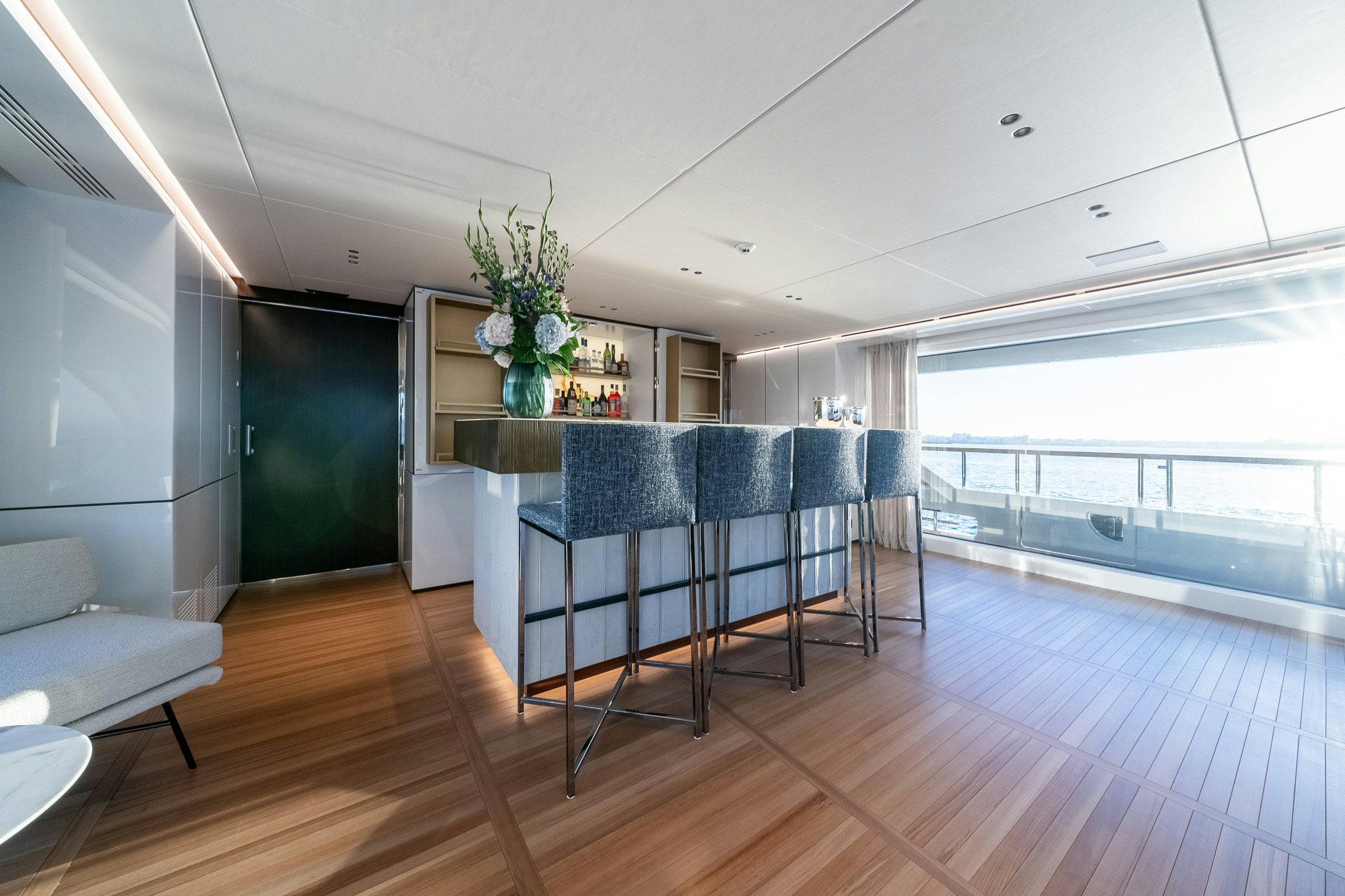 a room with a table and chairs aboard ALPHA WAVES Yacht for Charter
