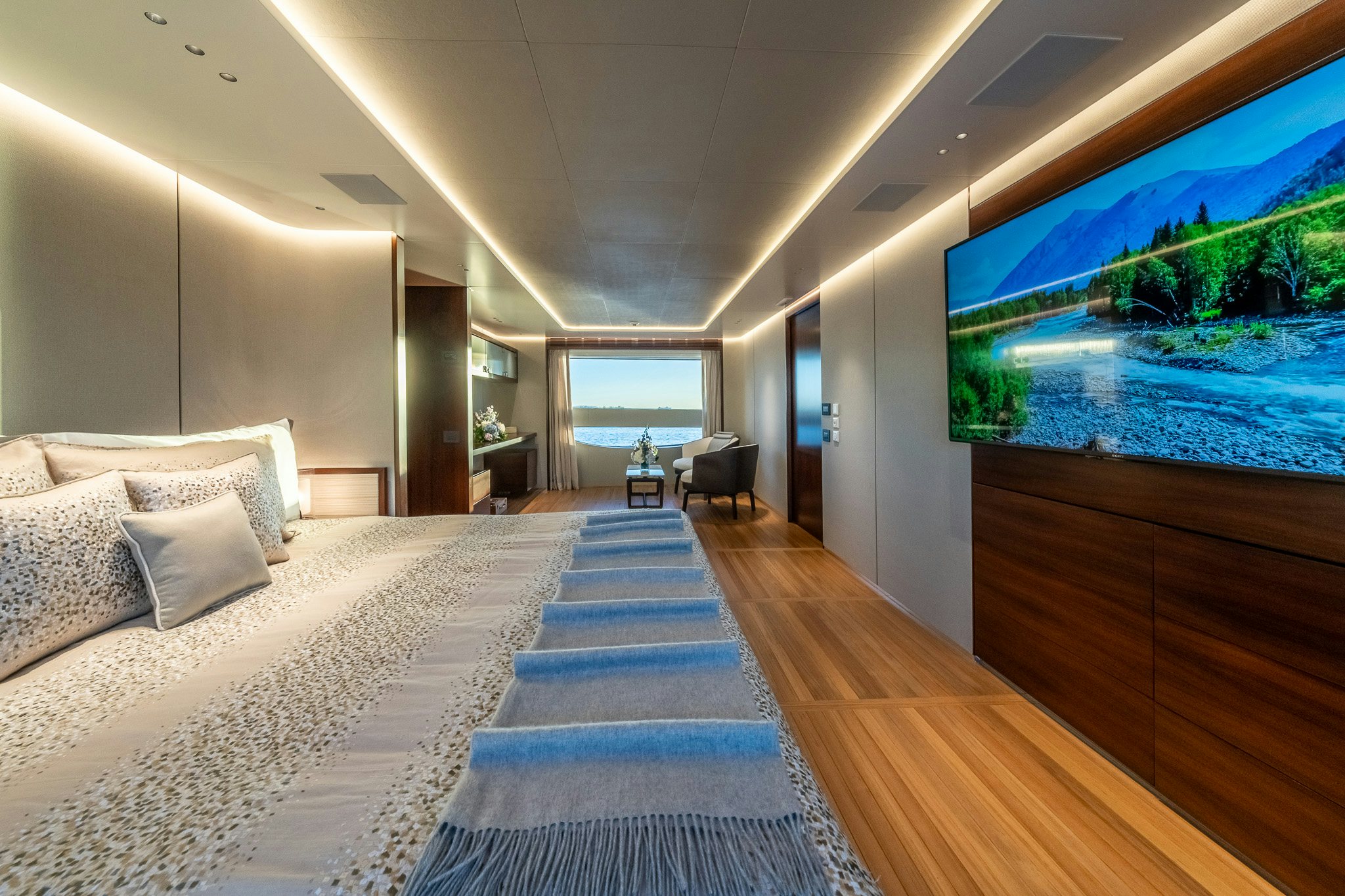 a room with a bed and a large fish tank aboard ALPHA WAVES Yacht for Charter