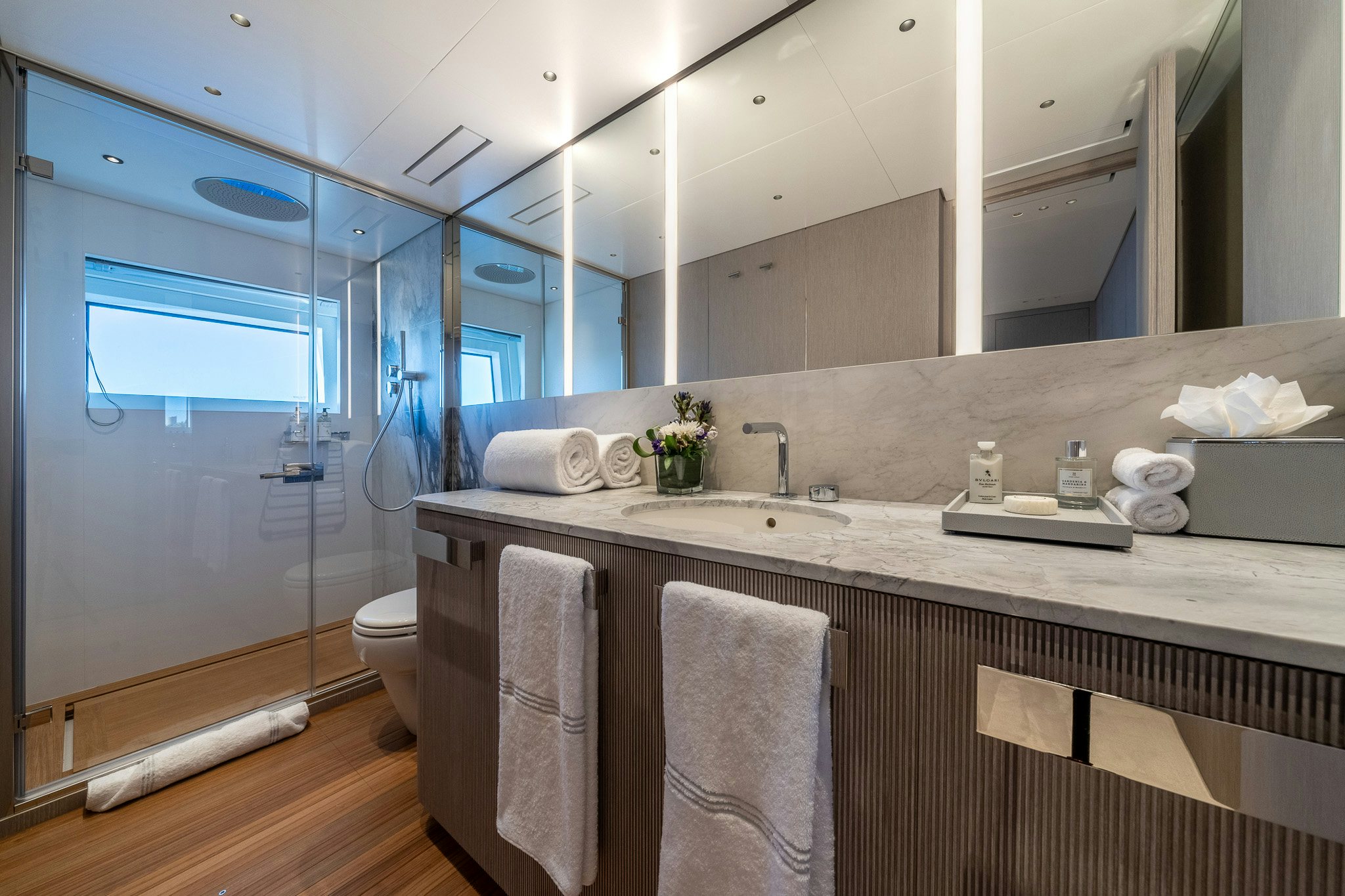 a bathroom with a large mirror aboard ALPHA WAVES Yacht for Charter