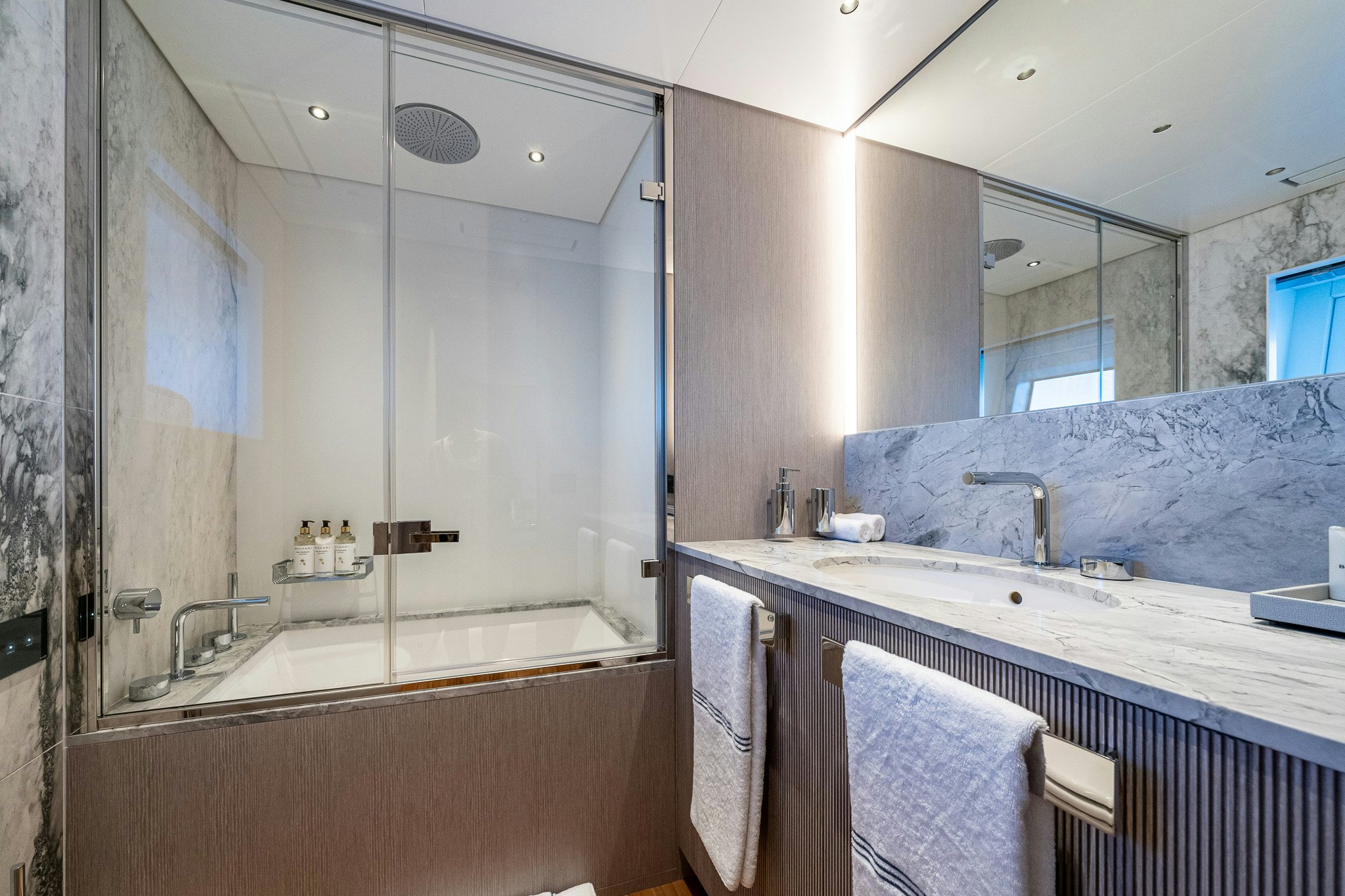 a bathroom with a large mirror aboard ALPHA WAVES Yacht for Charter