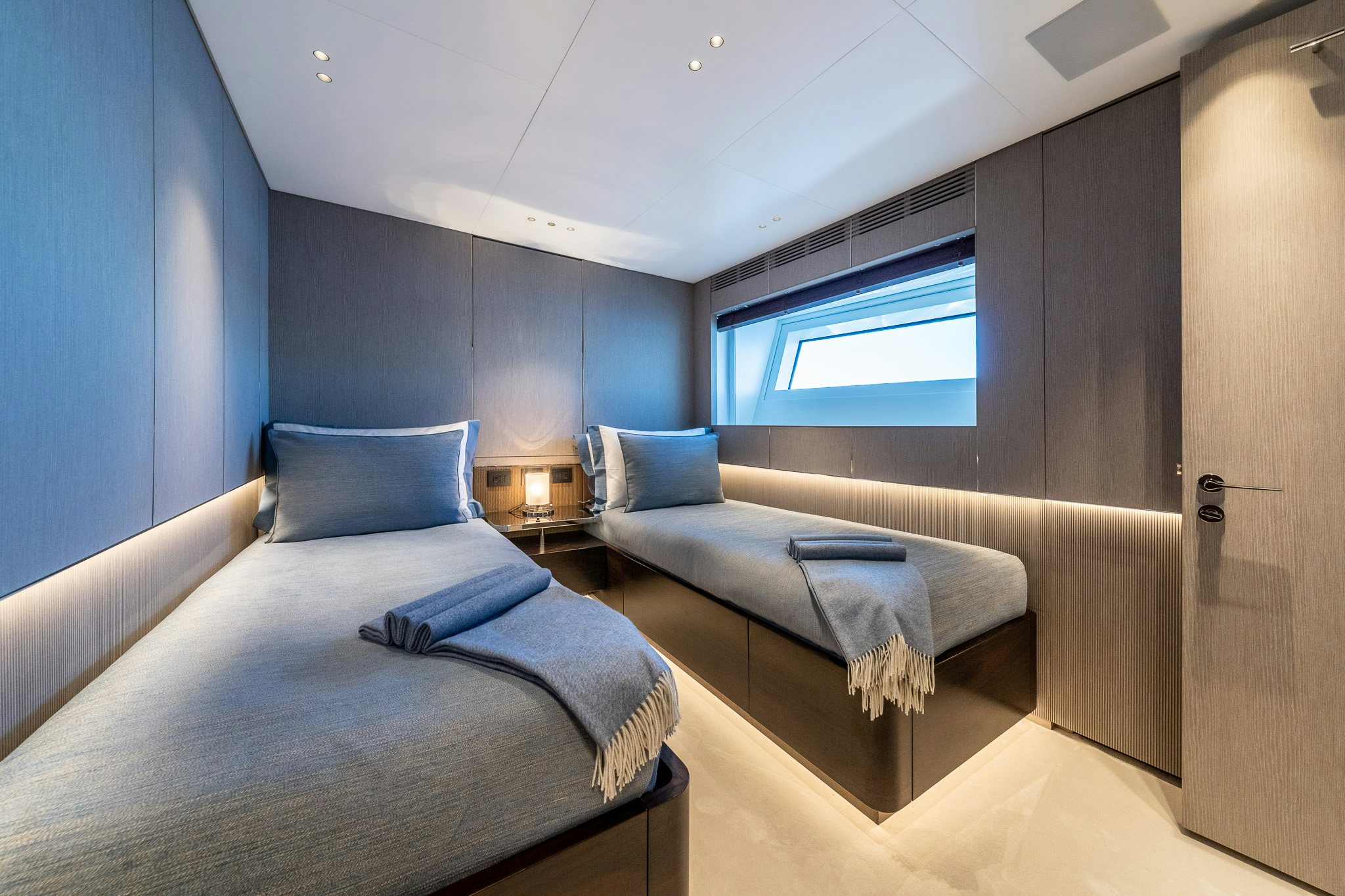 a room with two beds aboard ALPHA WAVES Yacht for Charter