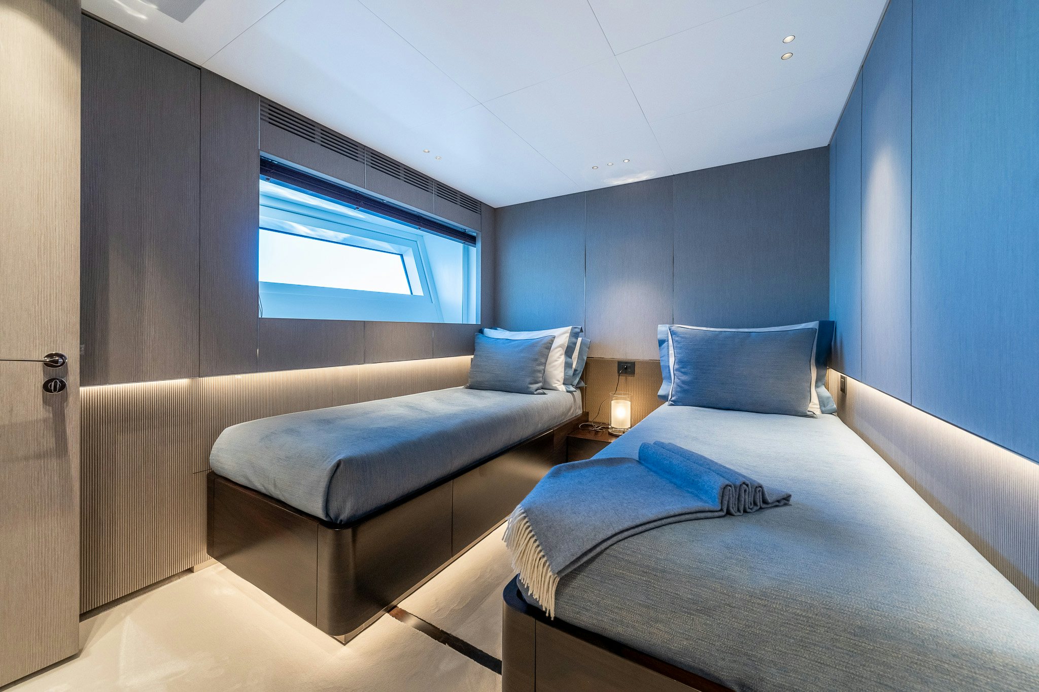 a room with a bed and a window aboard ALPHA WAVES Yacht for Charter