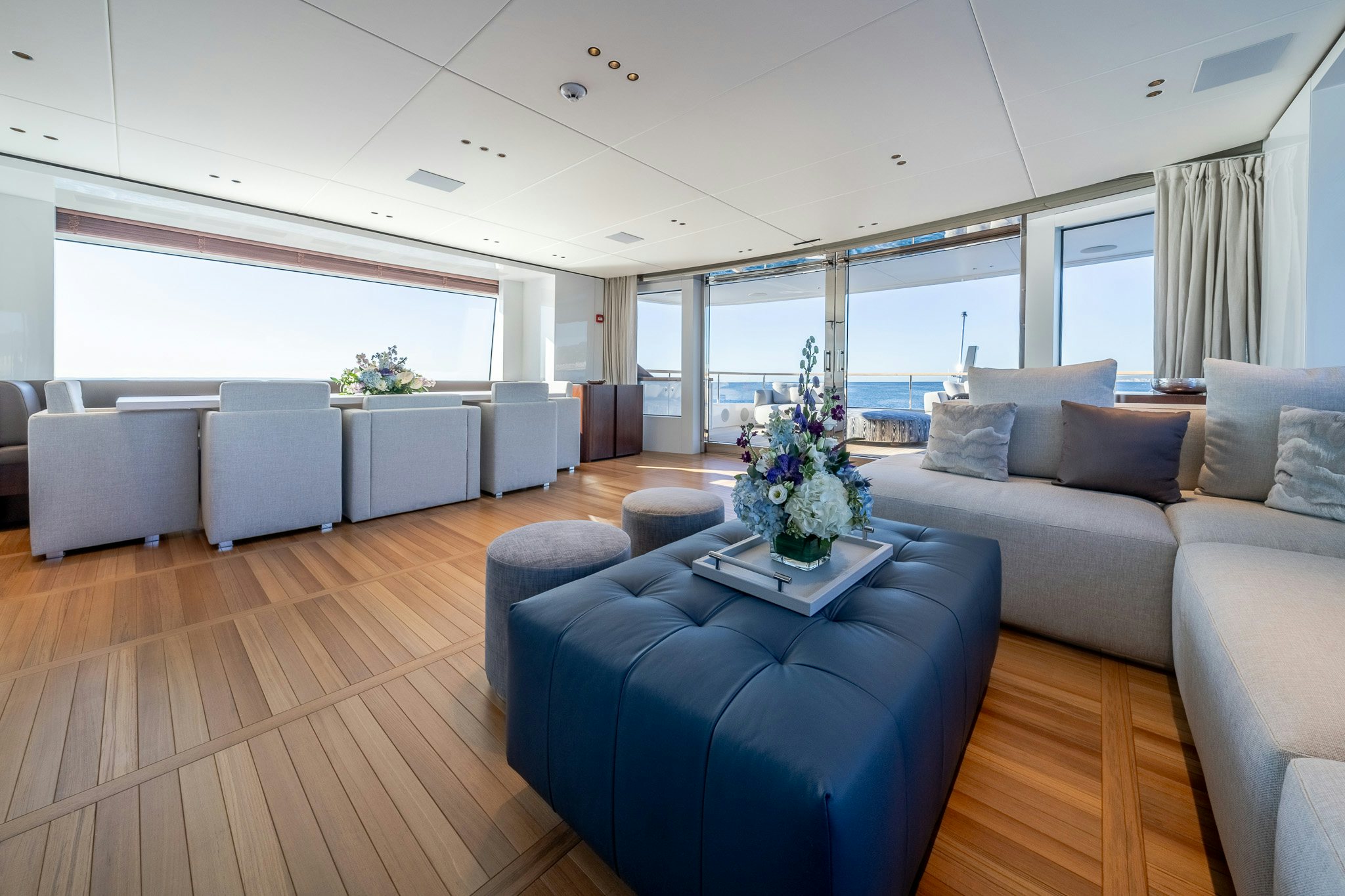 a living room with a couch and a table aboard ALPHA WAVES Yacht for Charter
