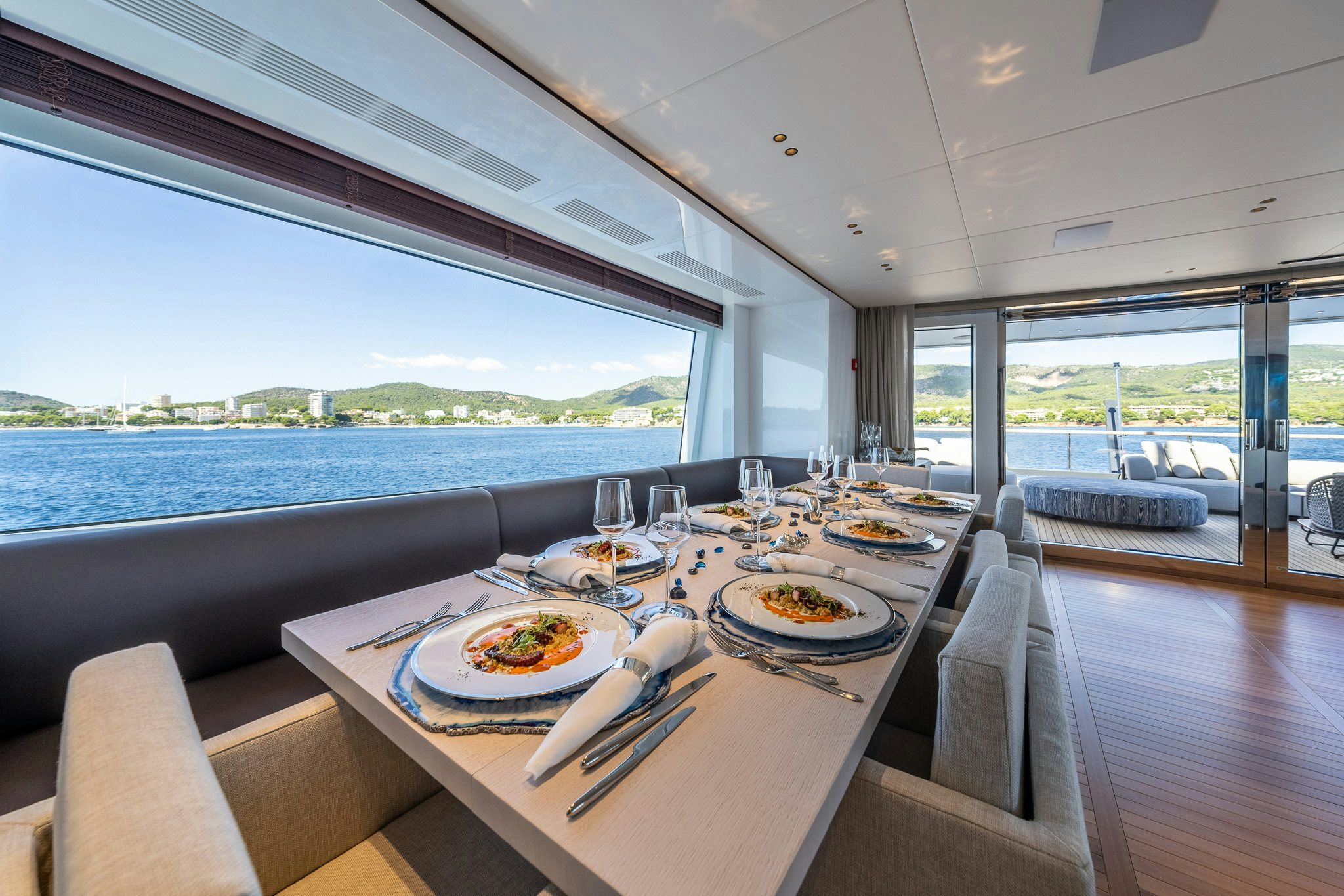 a dining table on a boat aboard ALPHA WAVES Yacht for Charter