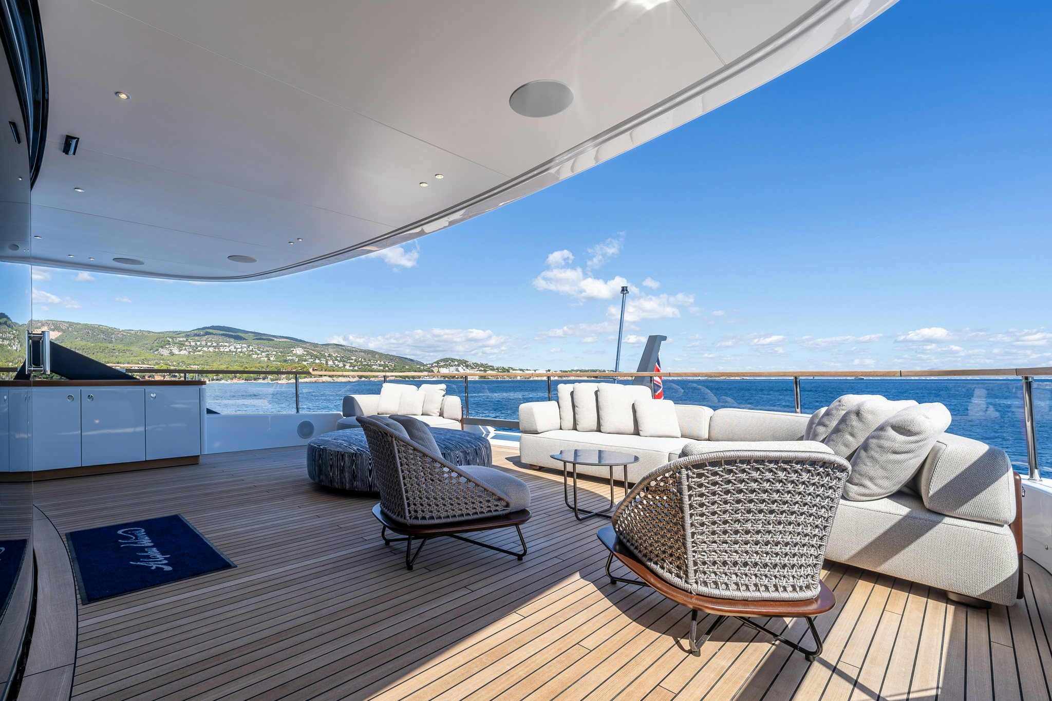 a deck with chairs and a view of the ocean aboard ALPHA WAVES Yacht for Charter