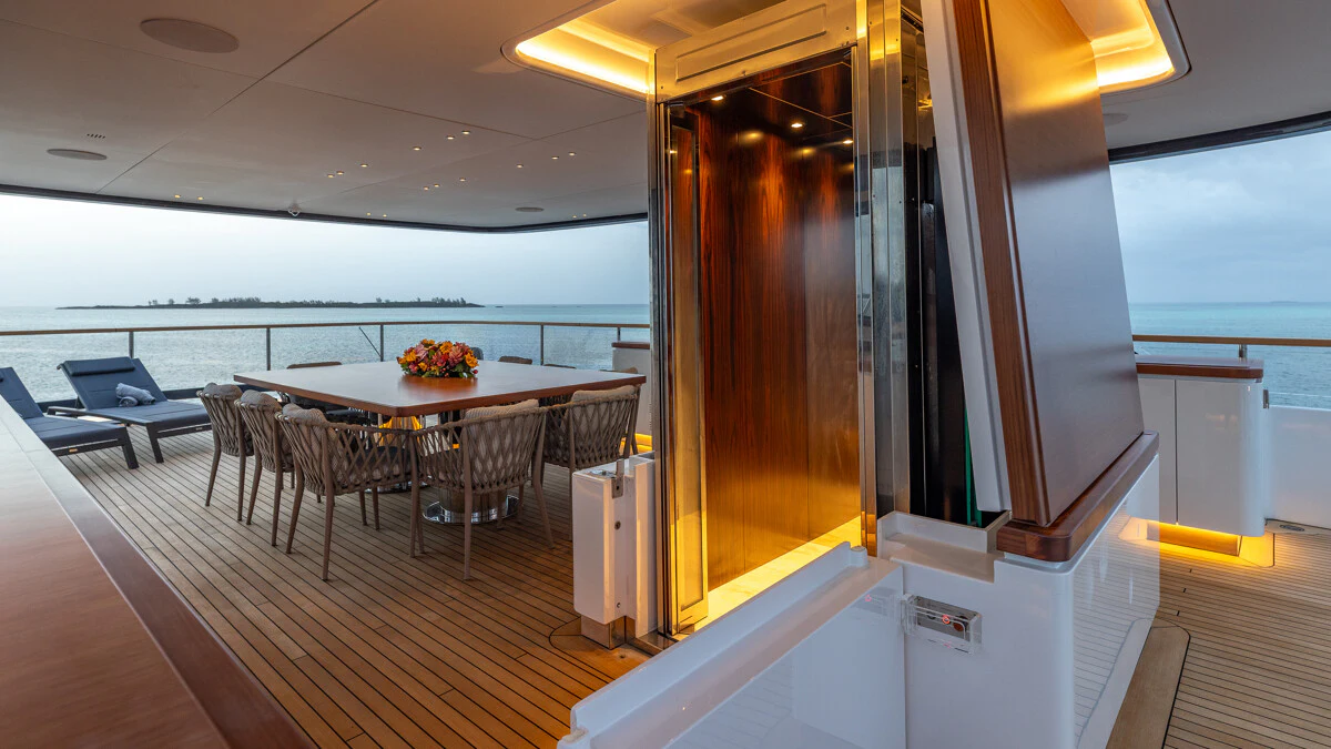 a room with a table and chairs aboard ALPHA WAVES Yacht for Charter