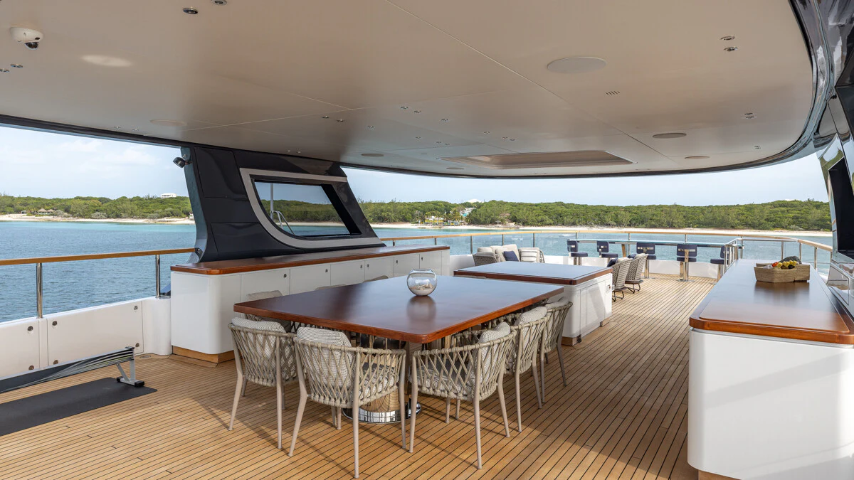 a room with a table and chairs aboard ALPHA WAVES Yacht for Charter