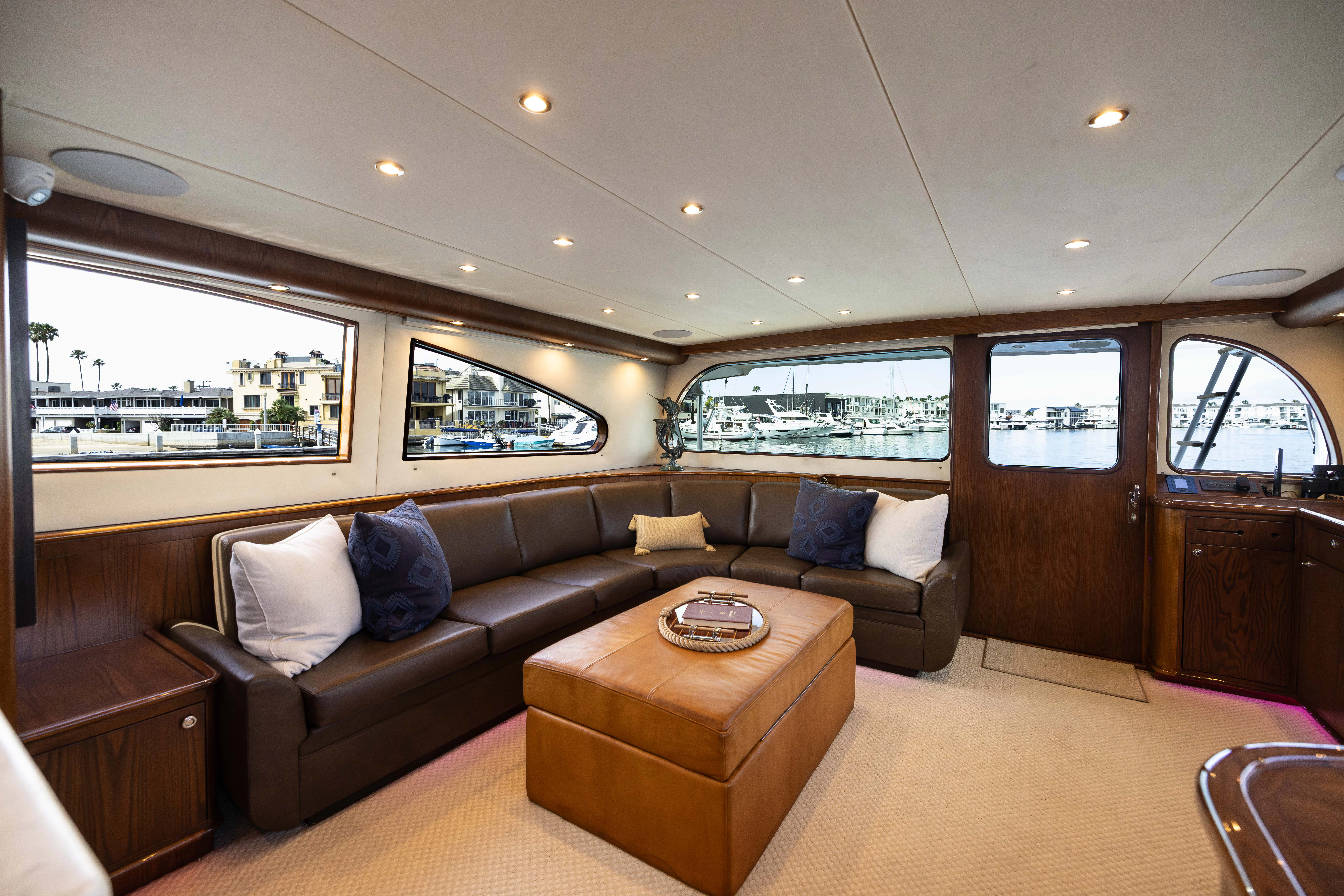 a living room with a couch and a table aboard VERTIGO Yacht for Sale