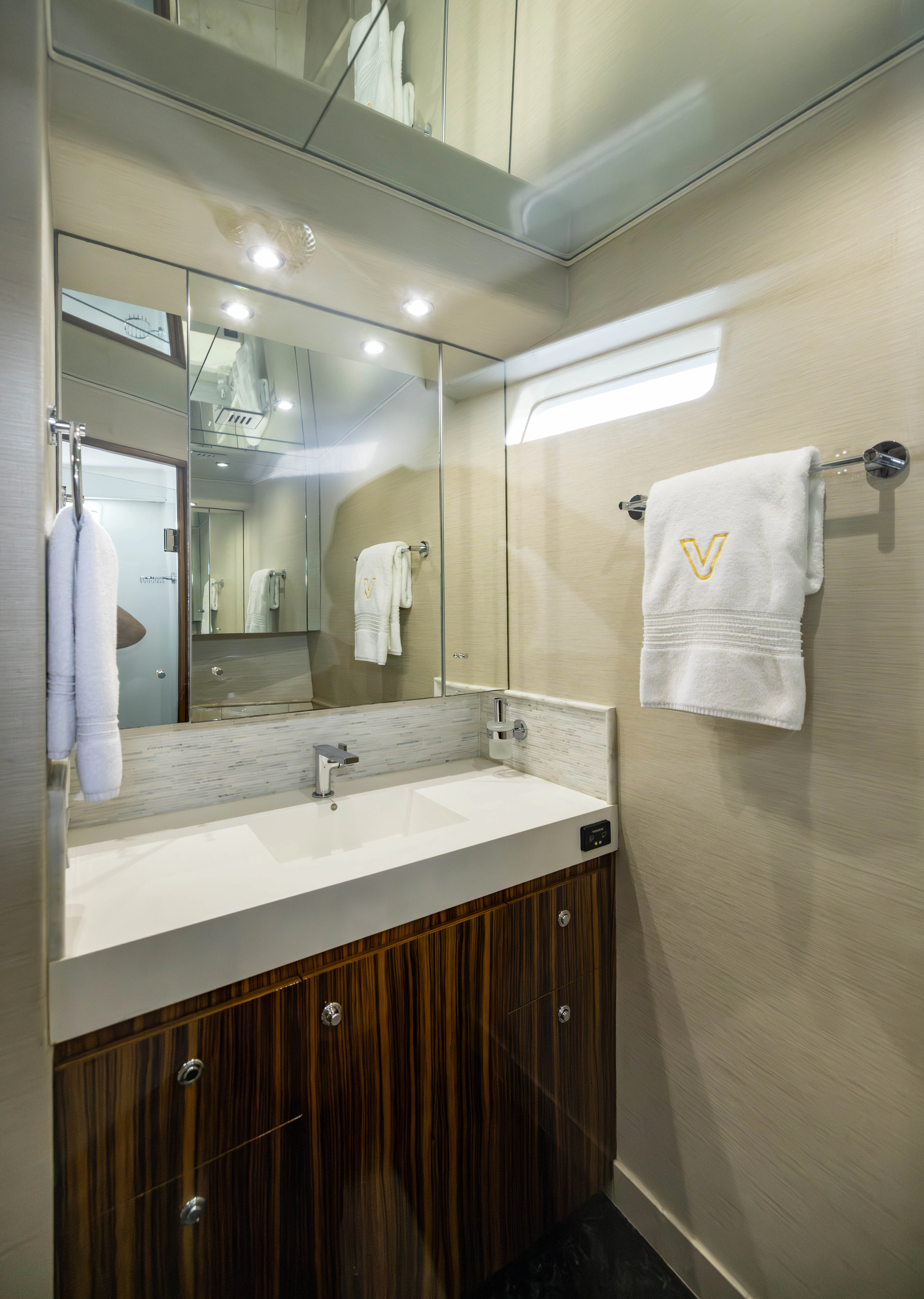 a bathroom with a large mirror aboard VERTIGO Yacht for Sale