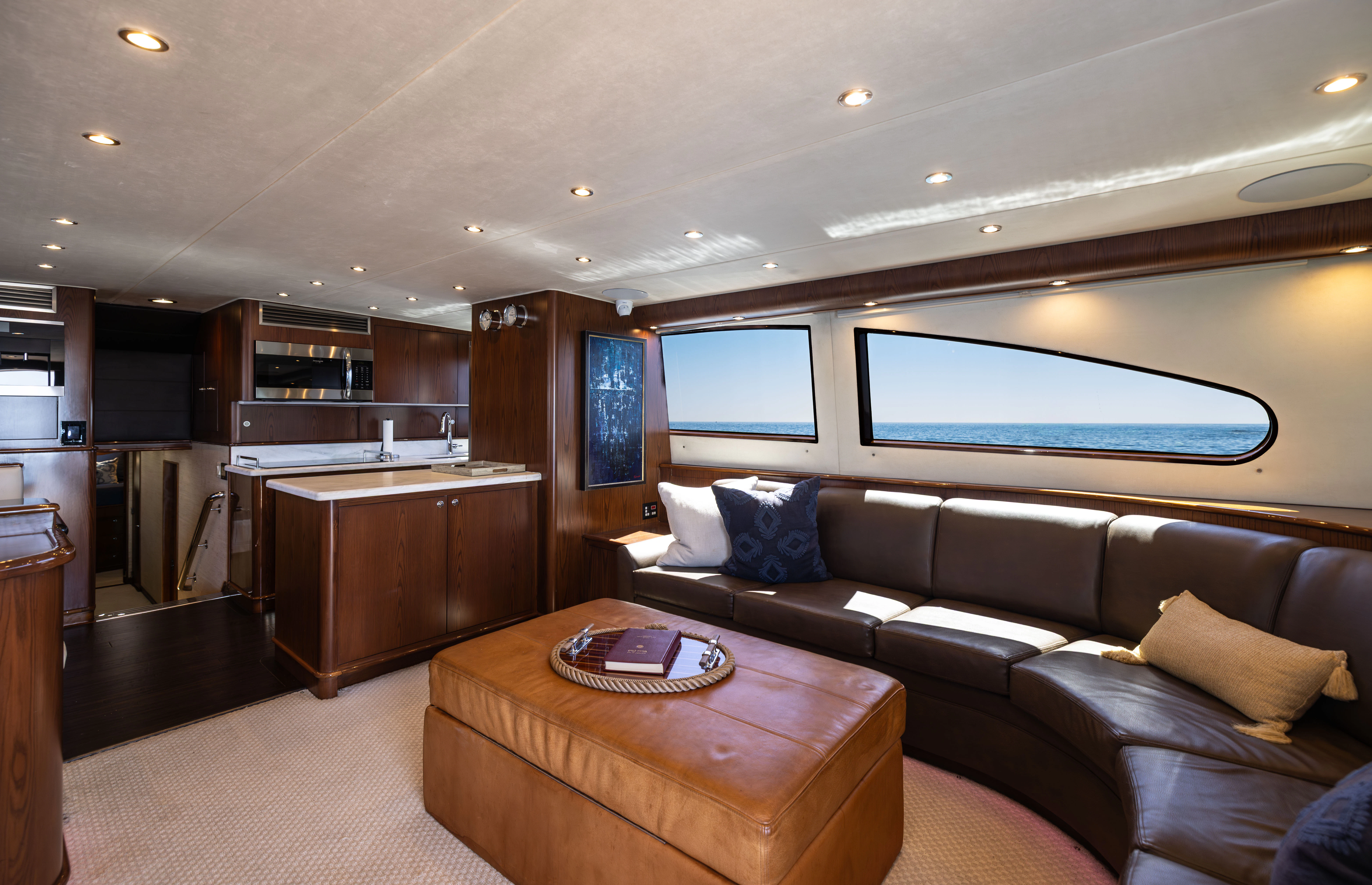 a living room with a couch and a tv aboard VERTIGO Yacht for Sale