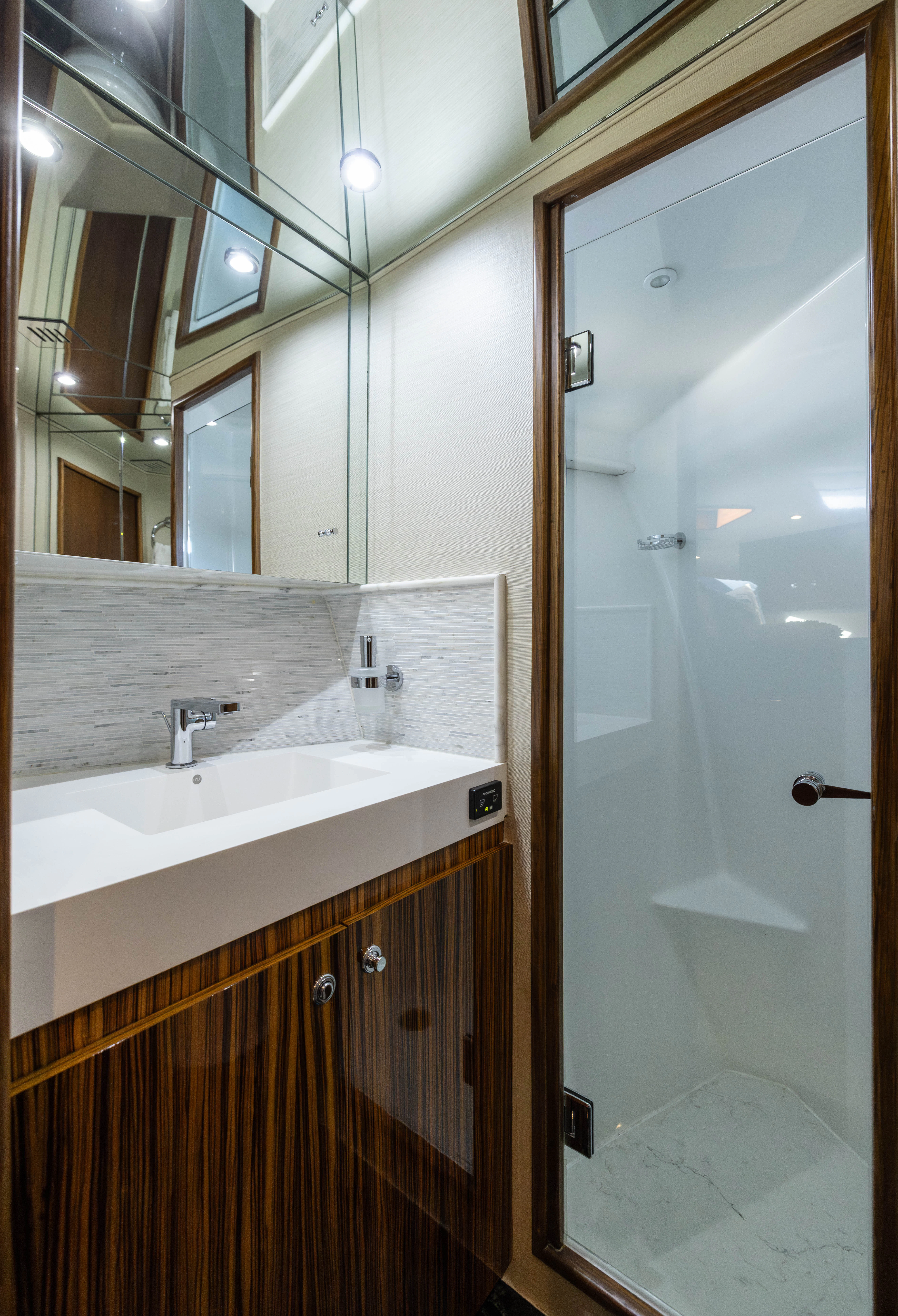 a bathroom with a sink and a mirror aboard VERTIGO Yacht for Sale