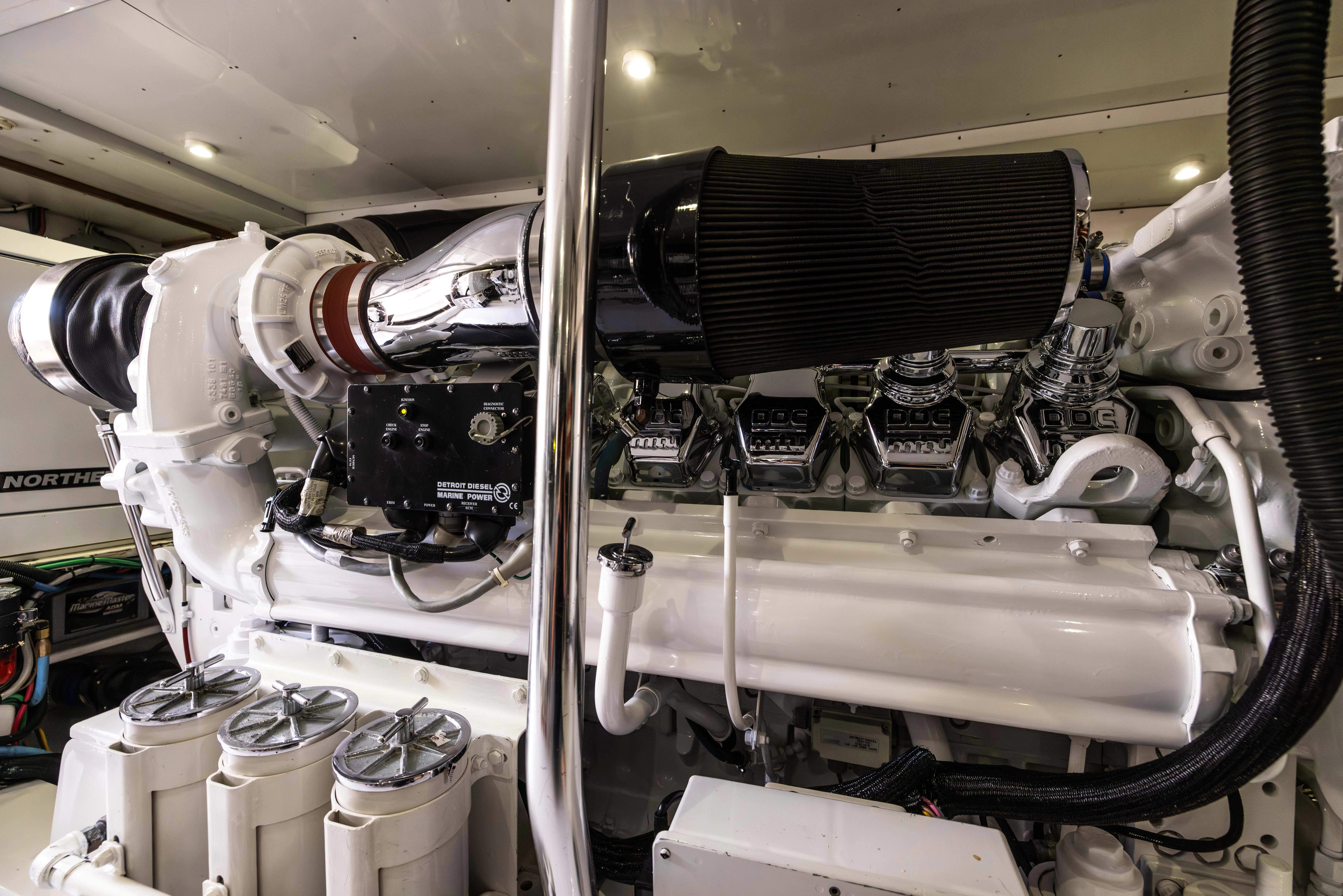 a car engine with a hood aboard VERTIGO Yacht for Sale