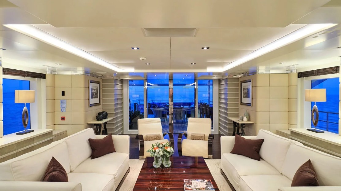 a living room with a large window aboard TIMBUKTU Yacht for Charter