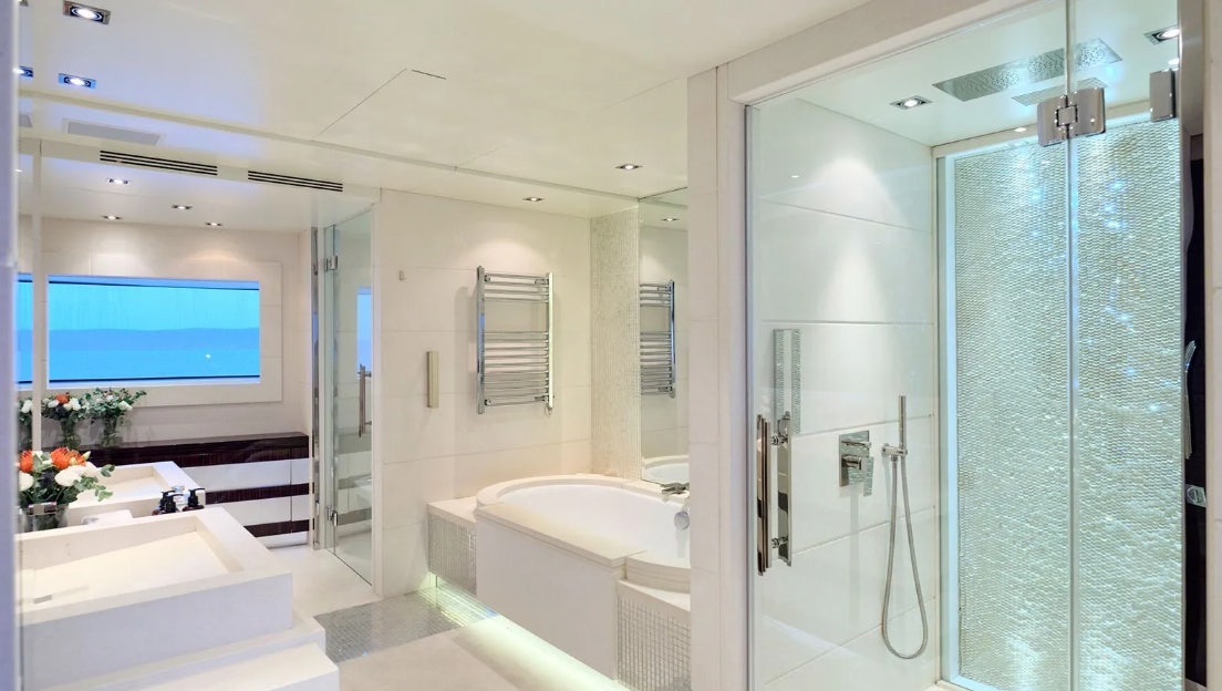 a bathroom with a glass shower aboard TIMBUKTU Yacht for Charter