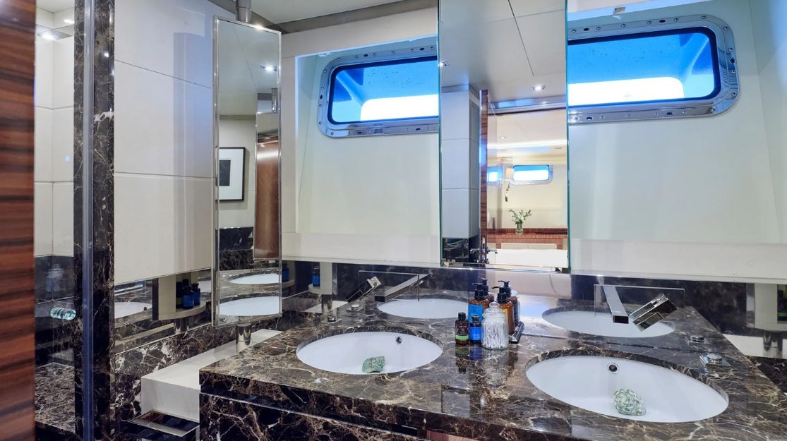 a bathroom with sinks and mirrors aboard TIMBUKTU Yacht for Charter