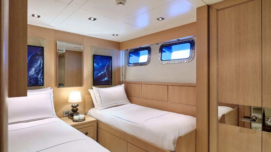 a room with two beds aboard TIMBUKTU Yacht for Charter
