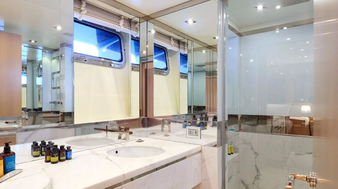 a bathroom with a large mirror aboard TIMBUKTU Yacht for Charter