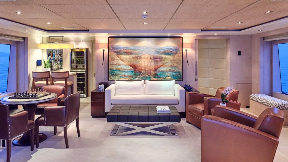 a living room with a large screen aboard TIMBUKTU Yacht for Charter