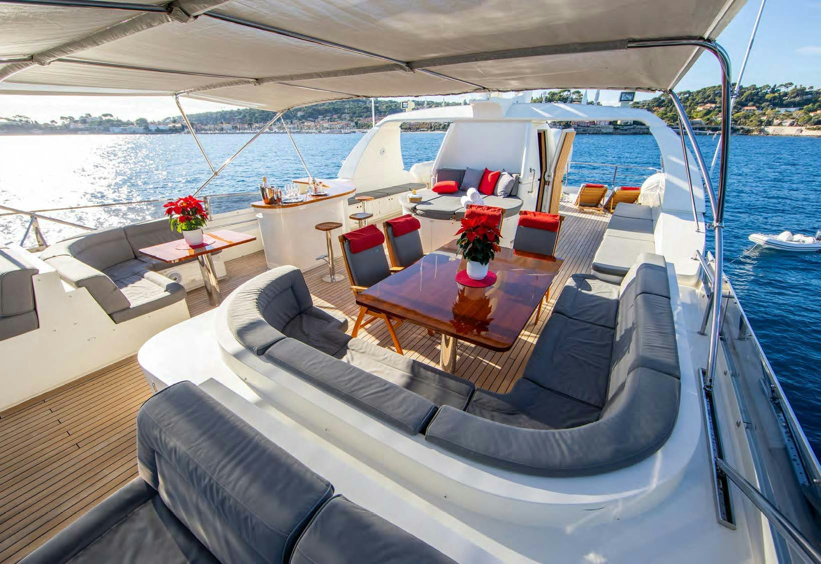 a boat with a table and chairs on it aboard VIKING III Yacht for Sale