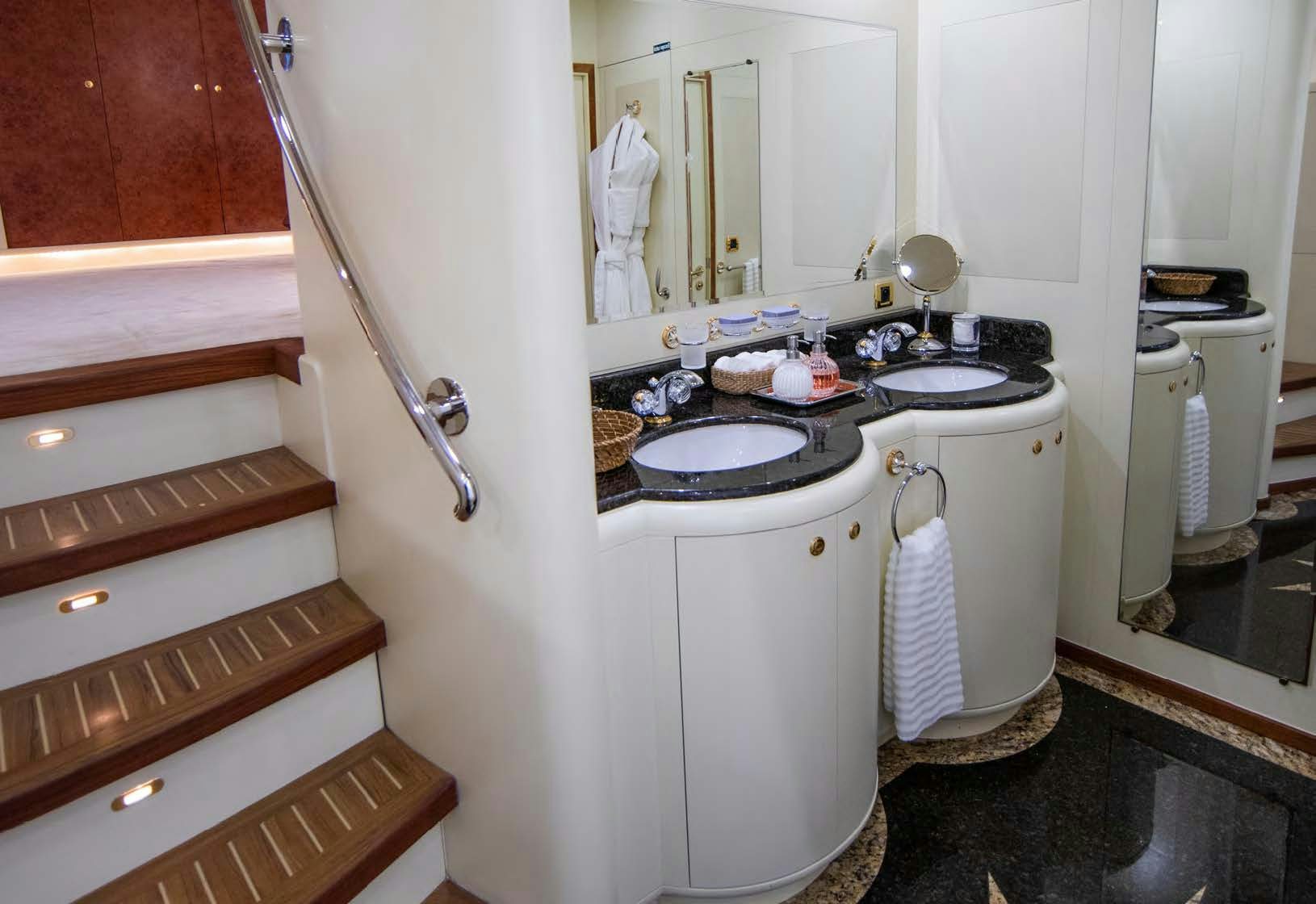 a bathroom with a sink and a mirror aboard VIKING III Yacht for Sale