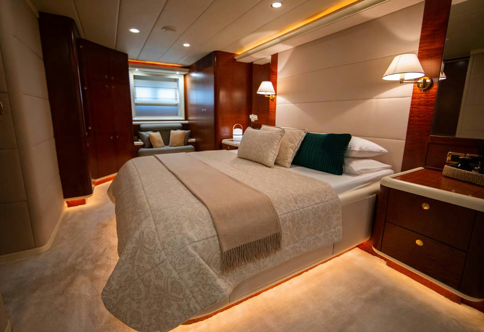 a large bed in a hotel room aboard VIKING III Yacht for Sale