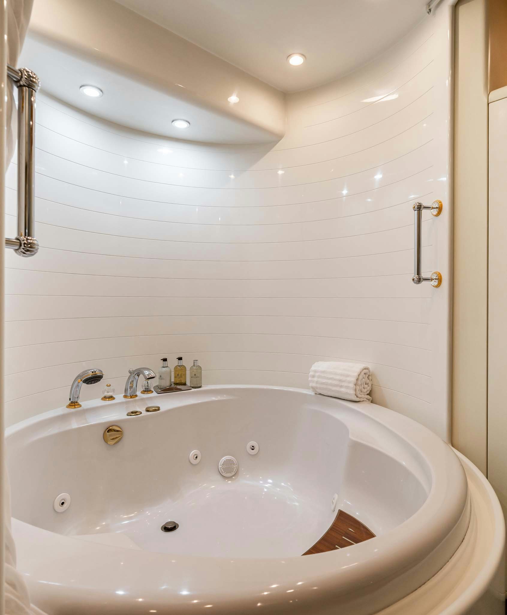 a bathroom with a large bathtub aboard VIKING III Yacht for Charter