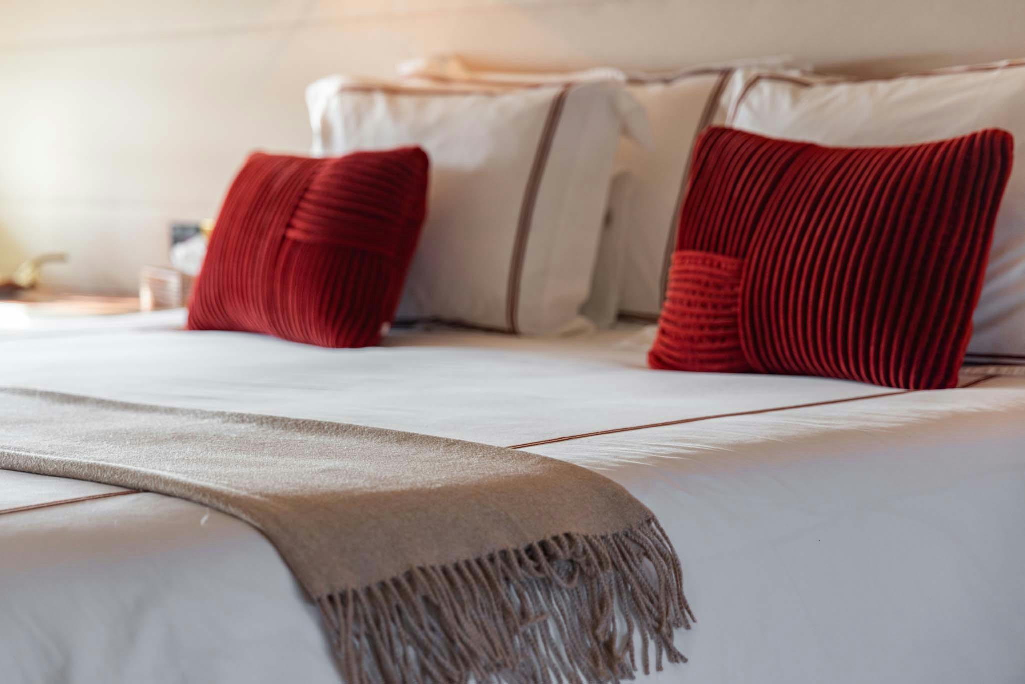 pillows on a bed aboard VIKING III Yacht for Charter