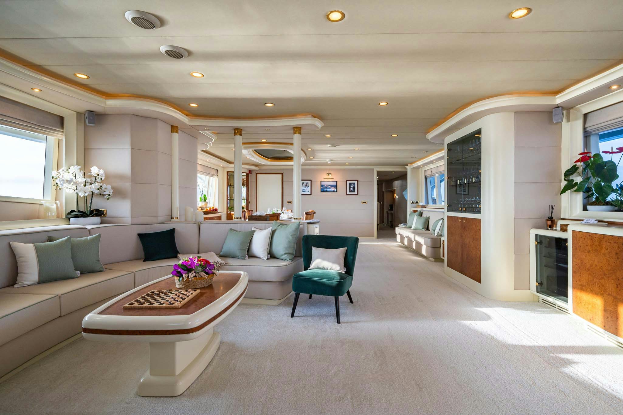 a living room with a couch and a table aboard VIKING III Yacht for Charter