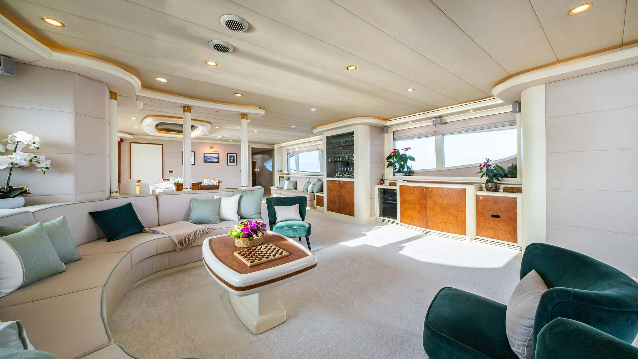 a living room with a couch and a table aboard VIKING III Yacht for Charter